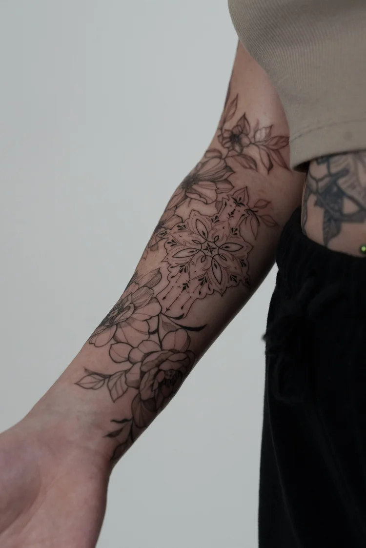 Floral and mandala half sleeve tattoo on the forearm