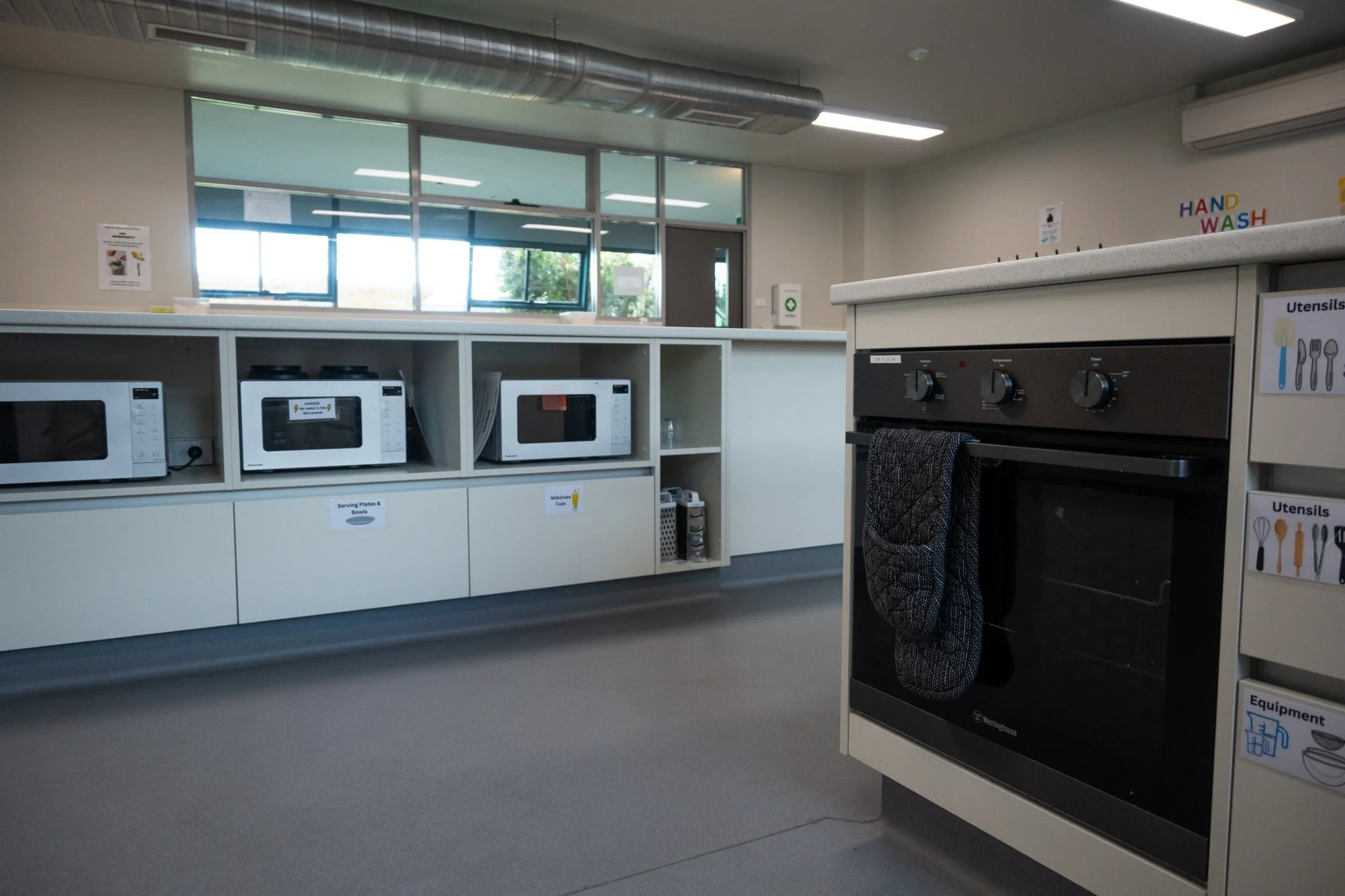 StPatricksCollege-KitchenClassroom-05-microwave-bench-oven.jpg