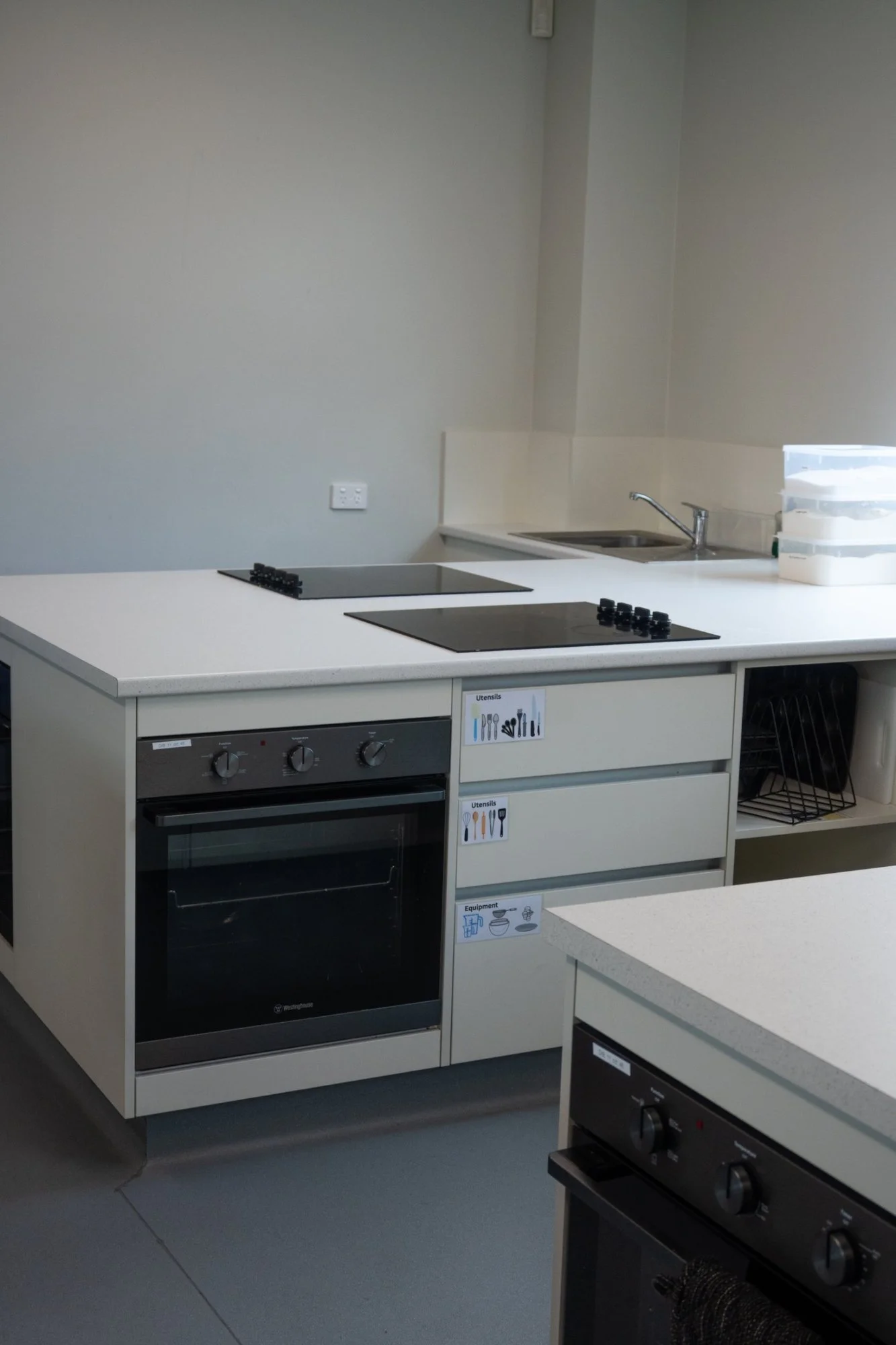 StPatricksCollege-KitchenClassroom-03-cooking-station-oven-drawers.jpg