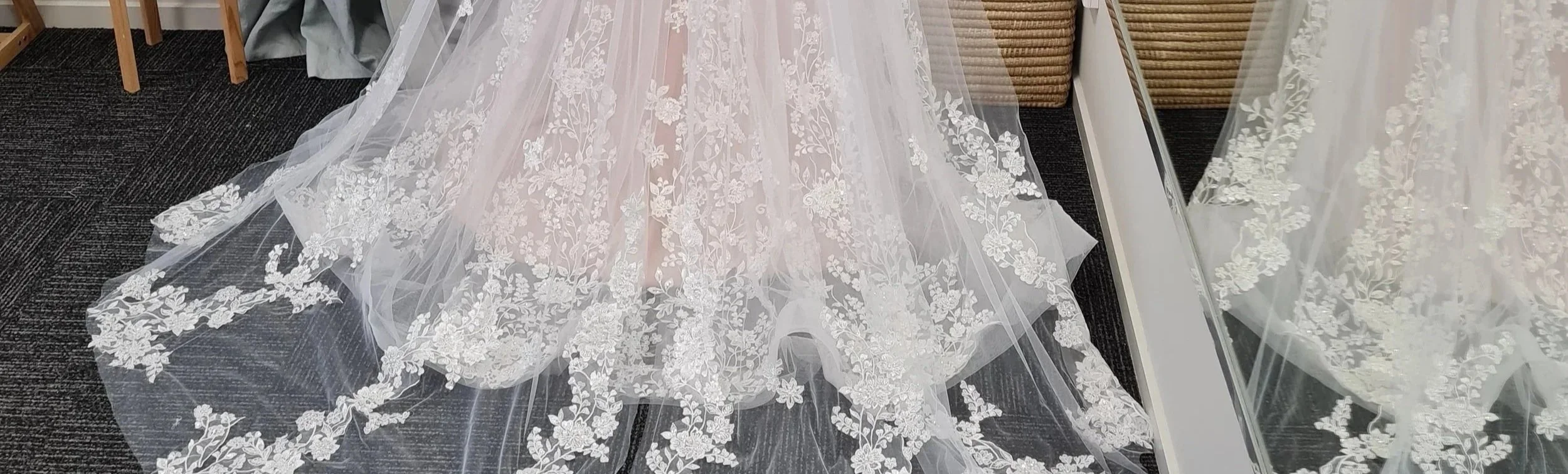 Close-up of delicate bridal lace fabric at Alena Hume alterations studio, Palmerston North