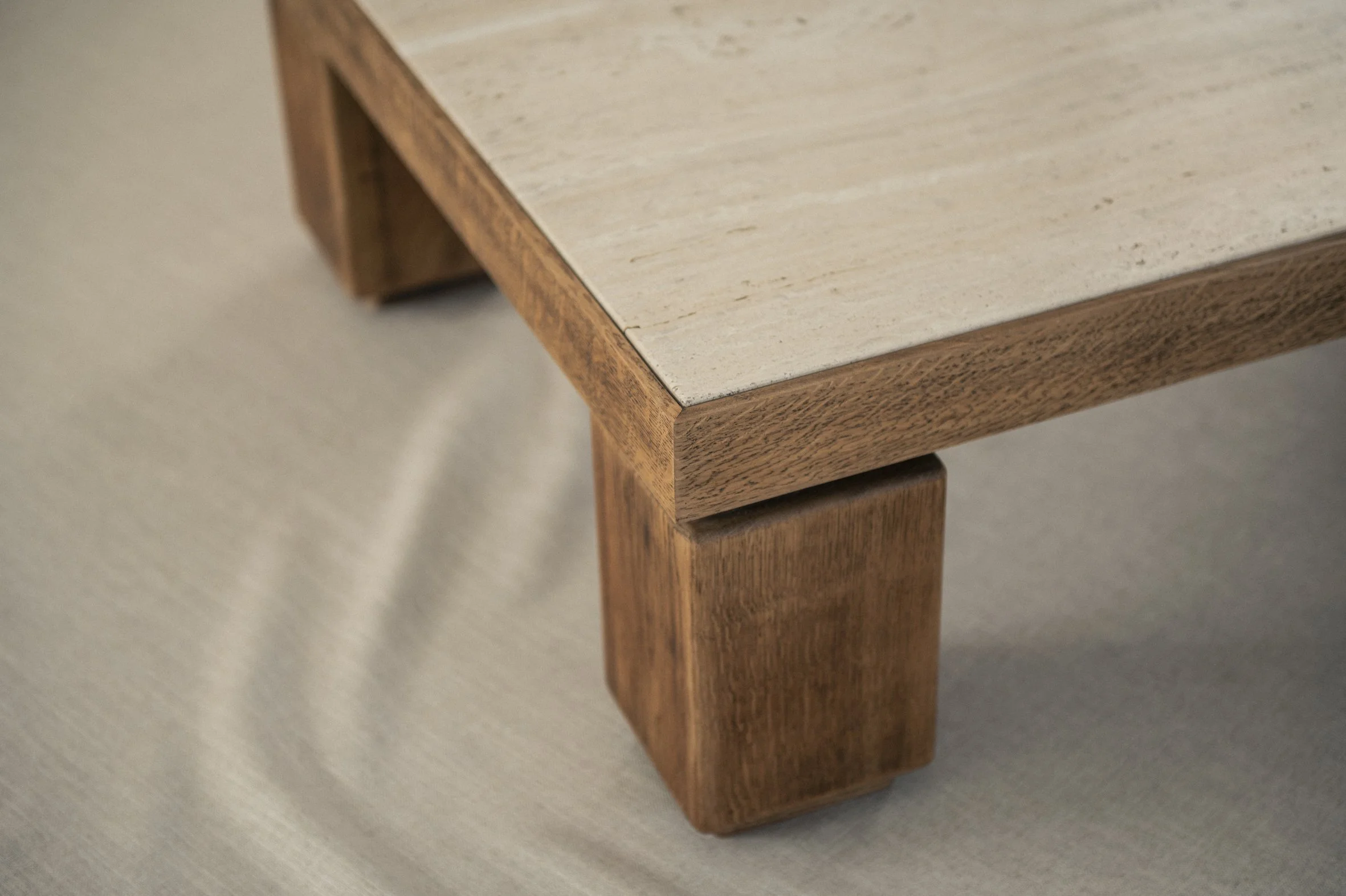 Large solid oak and travertine coffee table — (RE)APPROVED