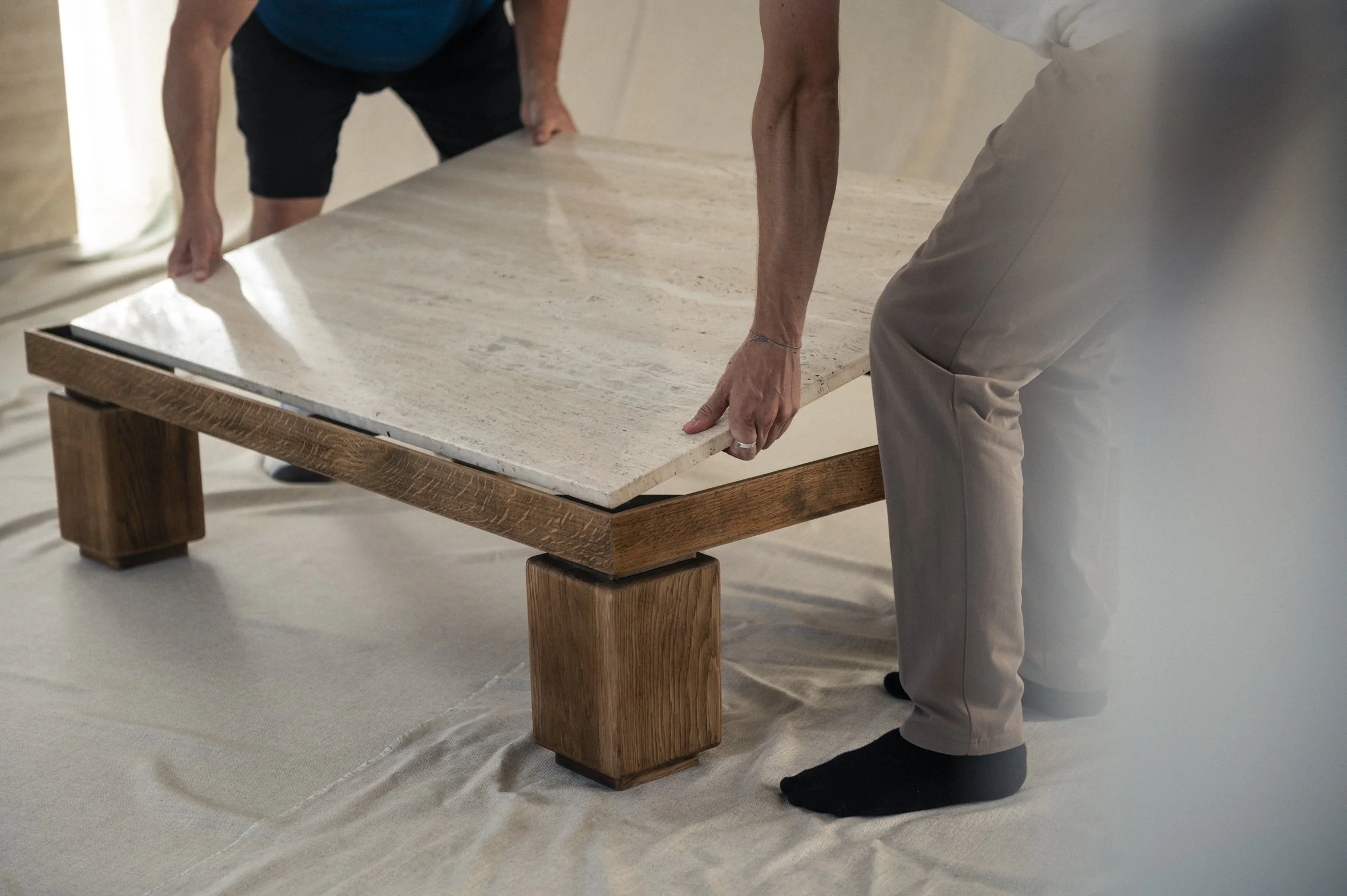 Large solid oak and travertine coffee table — (RE)APPROVED