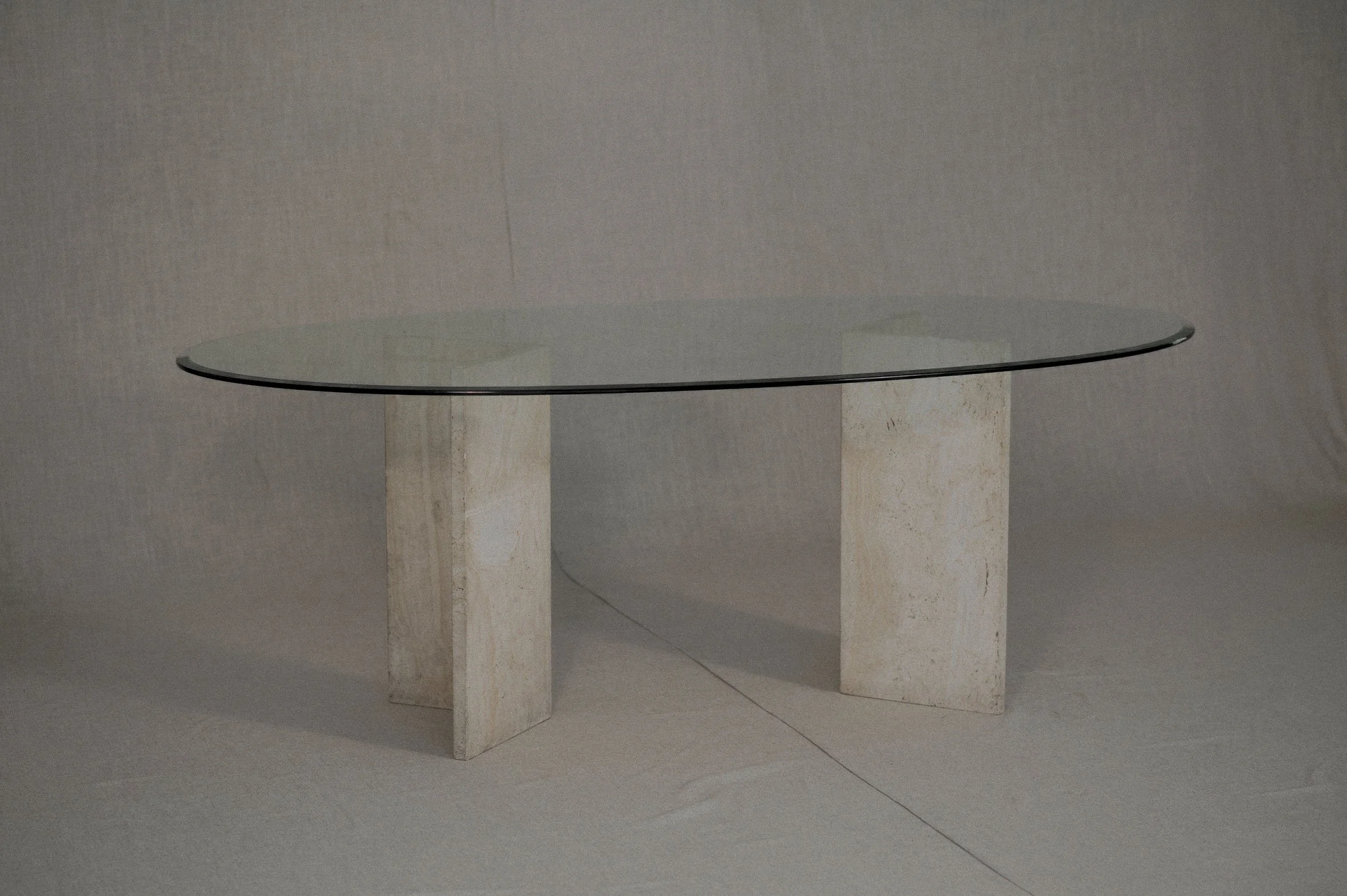 Large oval shaped travertine and glass dining table — (RE)APPROVED