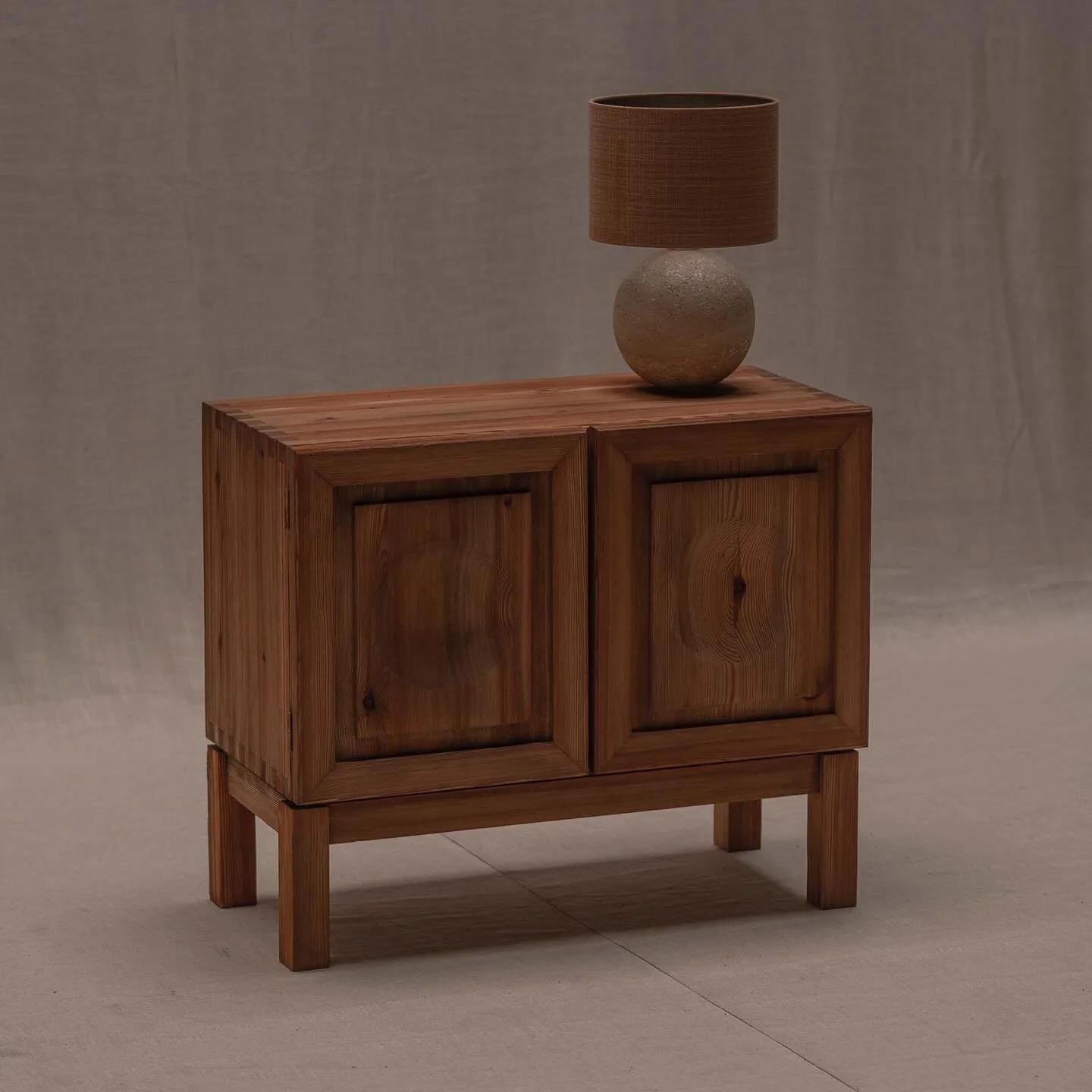 FOR SALE - Characteristic Brutalist two door cabinet. Made out of solid and veneered wood. Dutch piece dating from circa 1960. Natural texture of the wood complimenting the geometric compostion in the paneling. Small practical edition for every inter