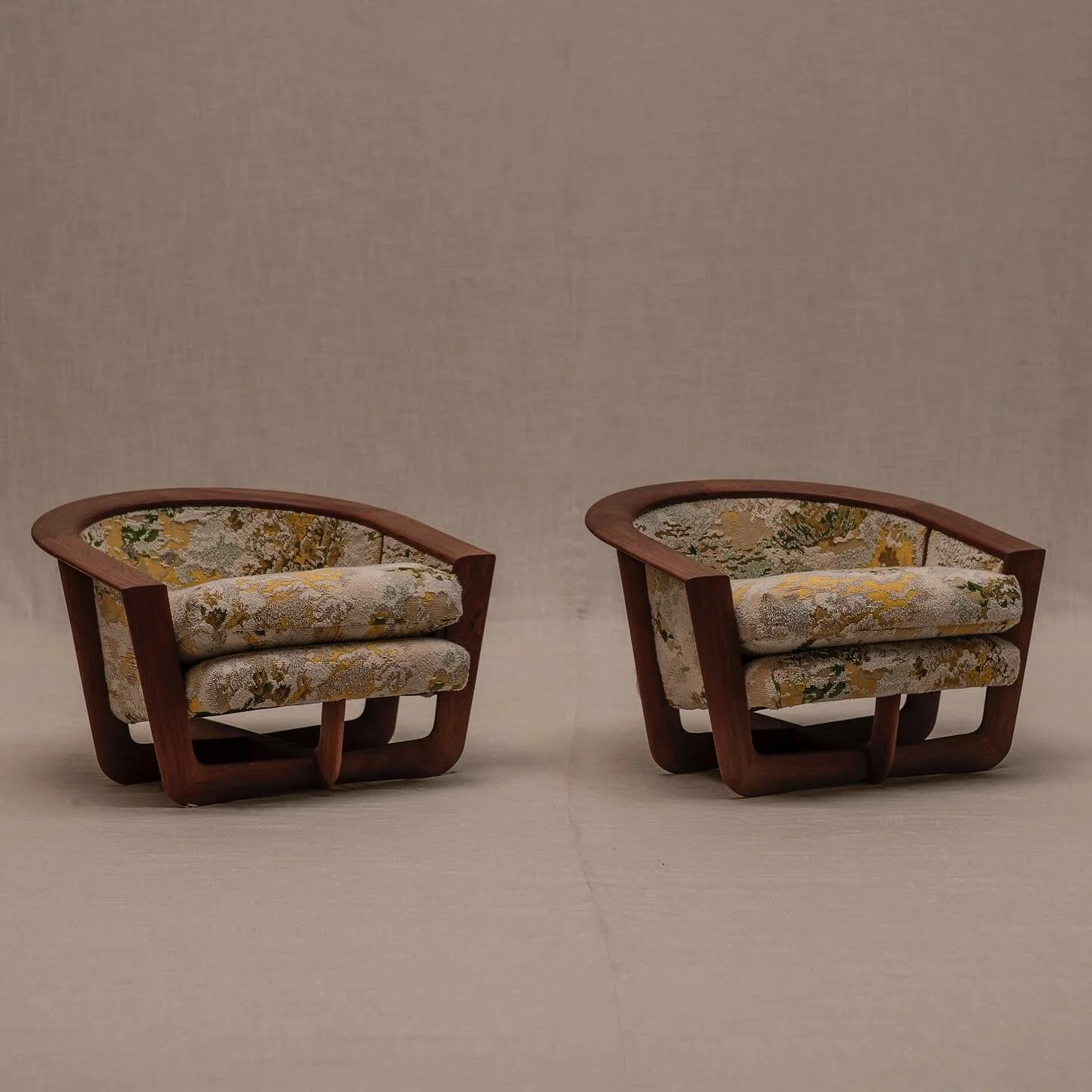 FOR SALE - Exceptional pair of vintage mid-century easy chairs. Stunning and elegant design with curved edges on all sides. Intricate play of lines where function meets beauty. Subtile details in the wooden joinery make this design stand out. A real 