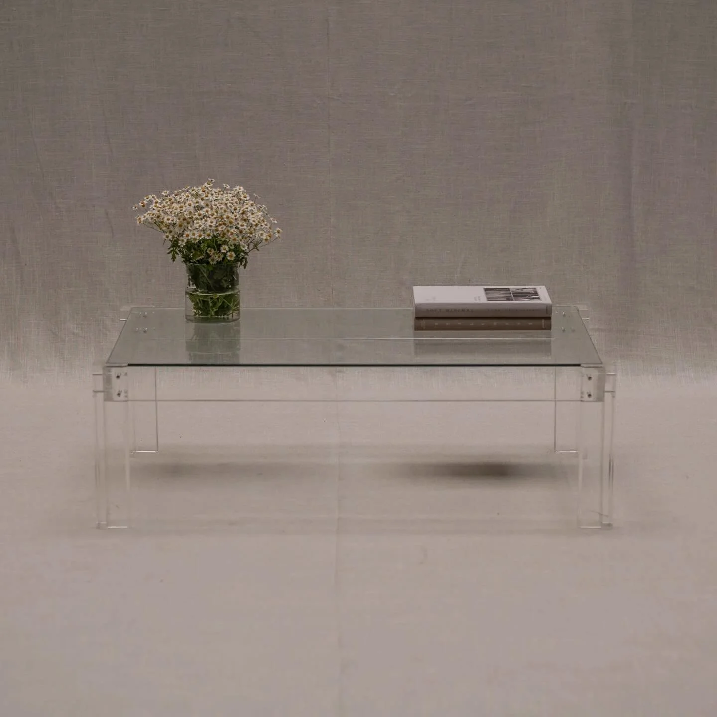 FOR SALE - Stunning and timeless rectangular shaped coffee table. Made out of a plexiglass construction with a glass table top. This see-true design completely dissolves in your interior and still makes quite the impression. French piece from the 197