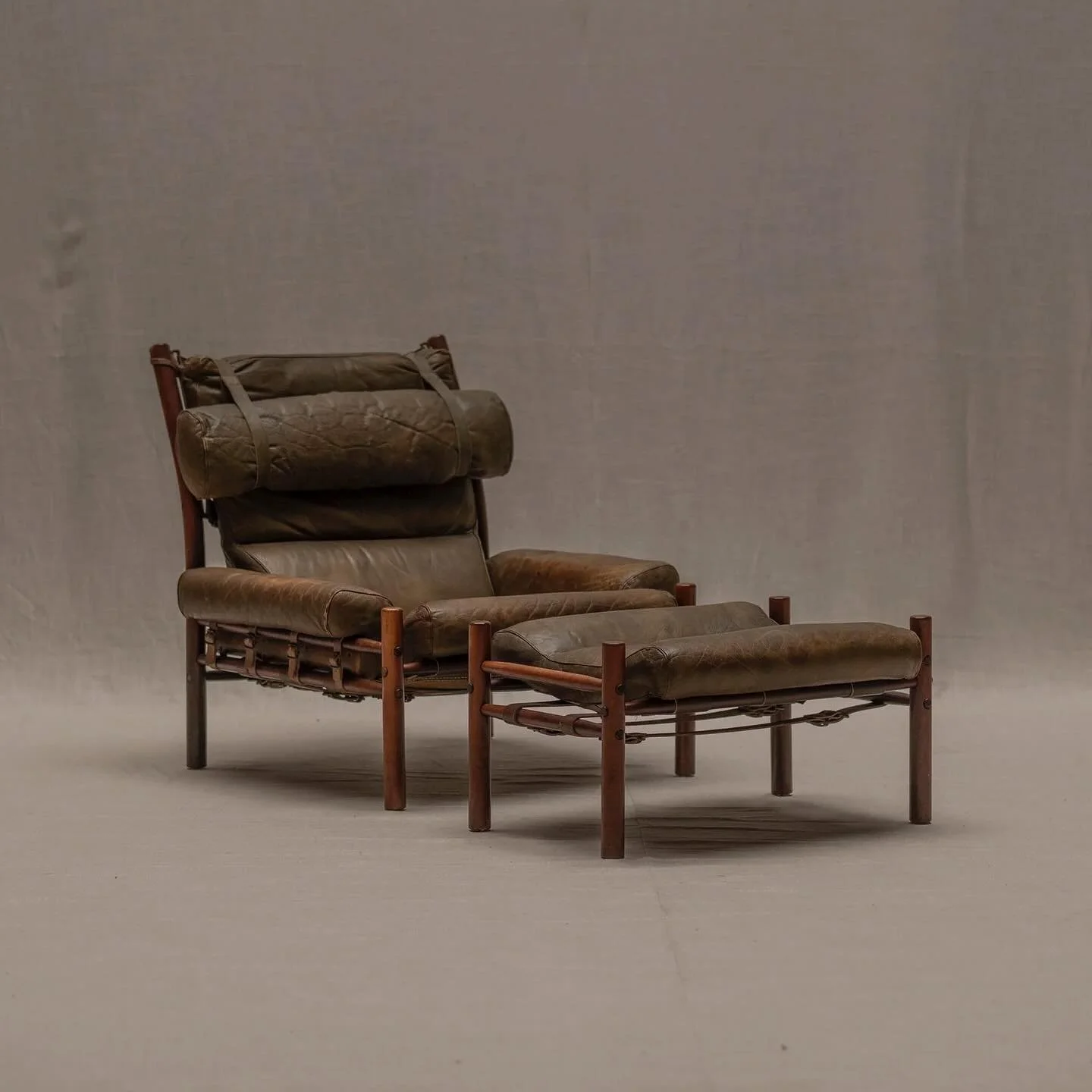Rare safari easy chair set model &lsquo;Inca&rsquo; complete with original ottoman. Designed by Arne Norell -for Norell M&ouml;bel AB Aneby. Lovely and rare original edition in olive green leather combined with a solid wooden frame. In general good v