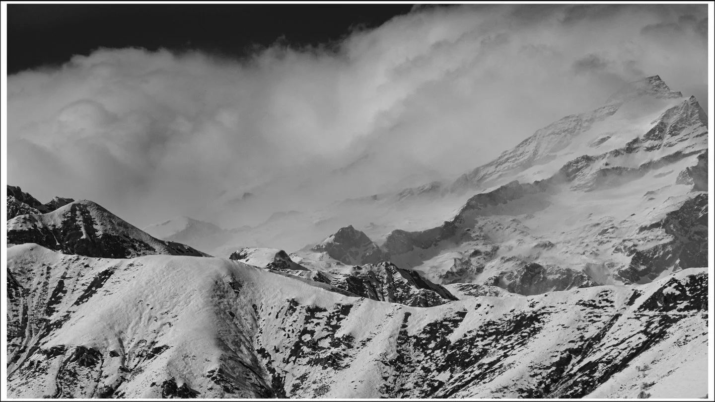 A stormy day in the mountains - last night I saw a forecast giving 150 kph winds at 3000m in some parts. Driving around this afternoon, you had to distinguish clouds from snow plumes off exposed ridges.
Gives for some atmospheric images!
This image l