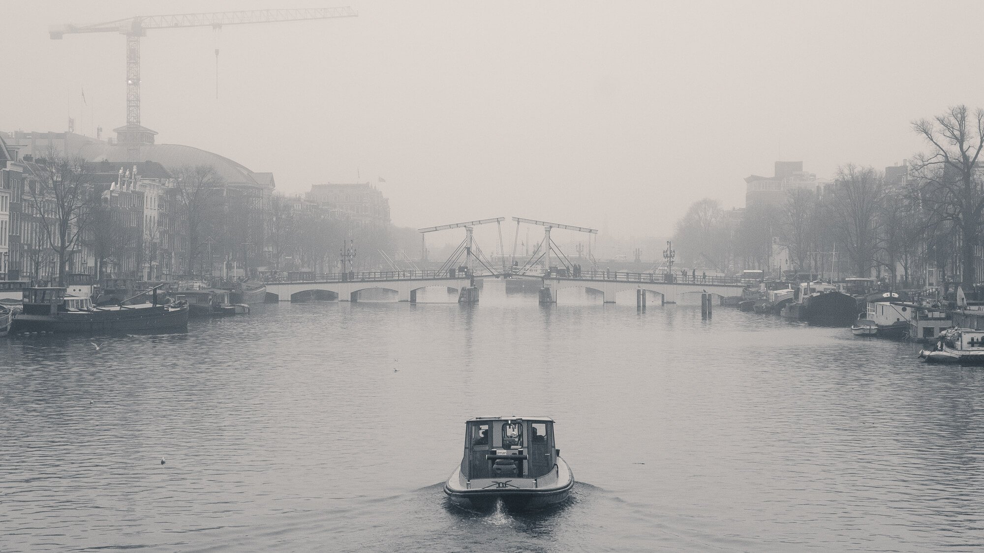 Looking down the Amstel river in Amsterdam to the Magere Brug