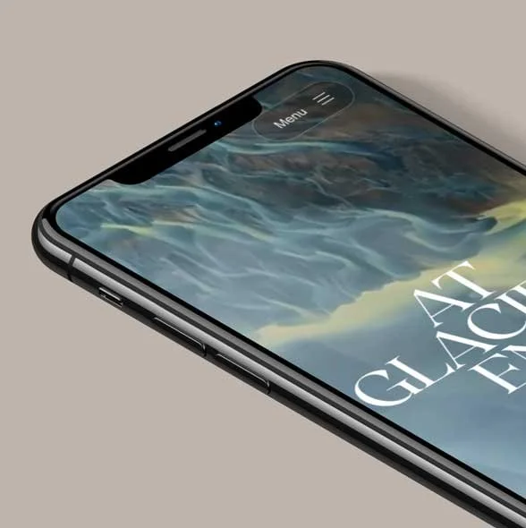 Close-up of a smartphone with a mountain landscape wallpaper, showing a menu icon and the text 'AT GLAC' on the screen.