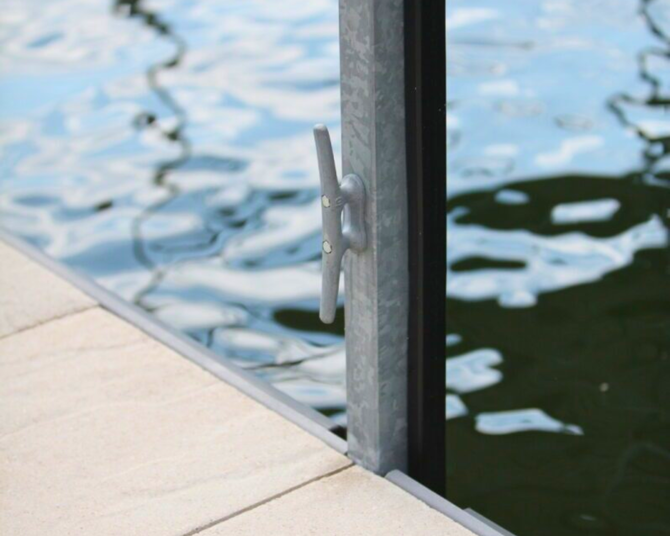 Galvanized dock cleat mounted on floating dock as part of K+R Manufacturing dock accessories and marine hardware collection