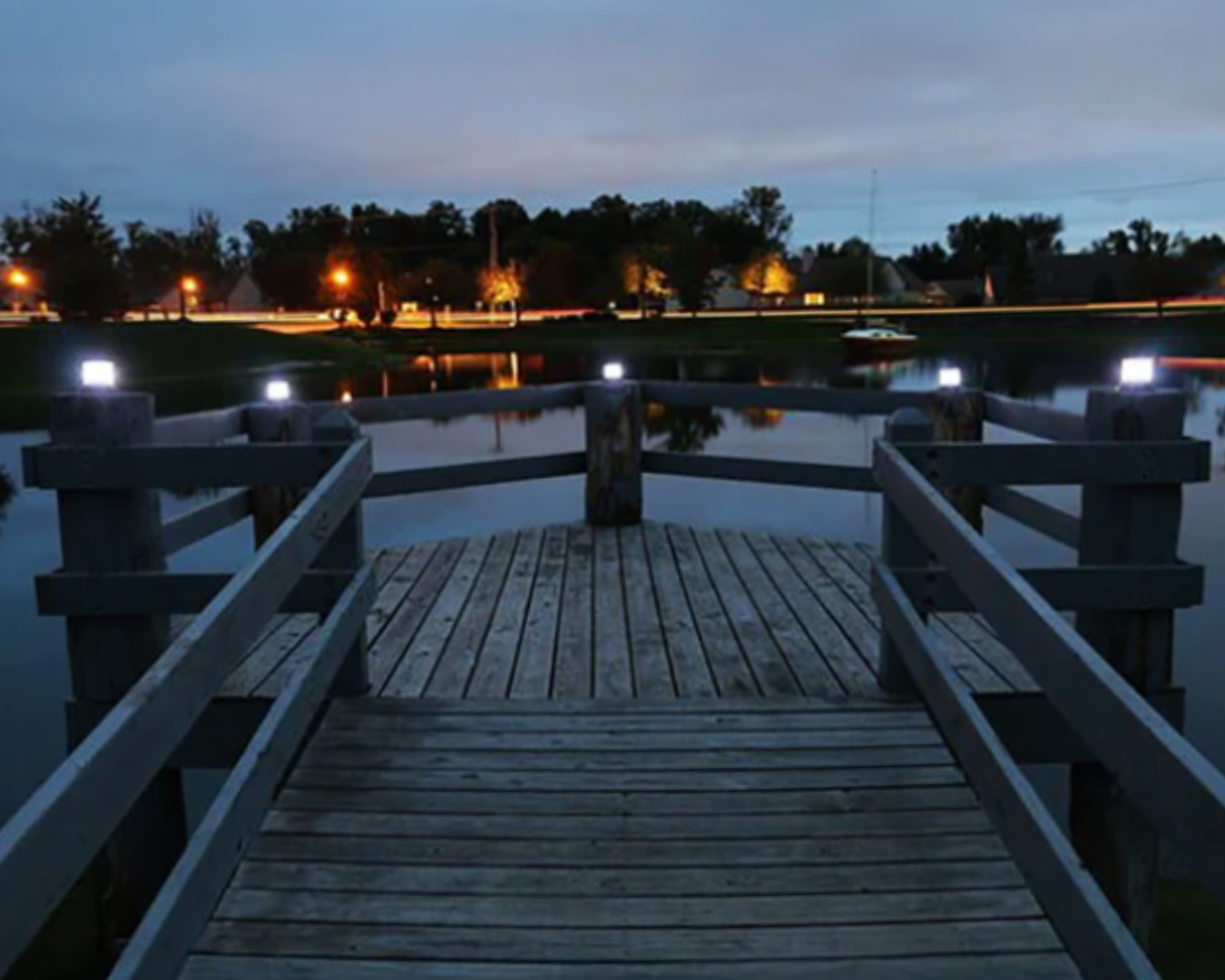 Solar marine lights installed on dock posts providing nighttime dock illumination by K+R Manufacturing