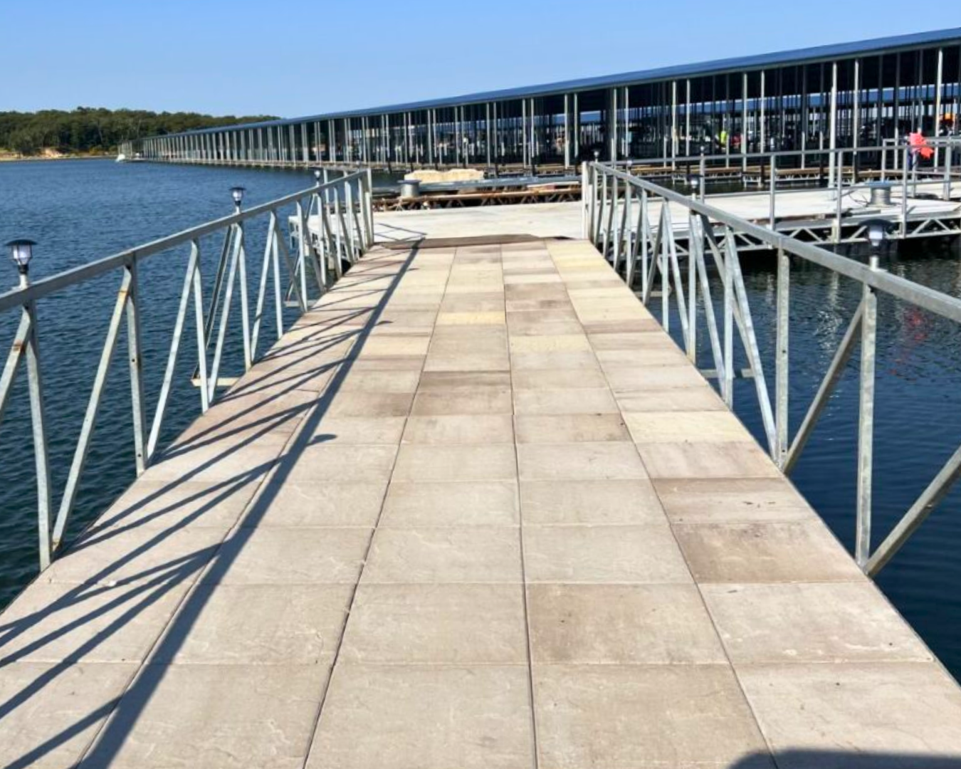 RockFace Evolution concrete dock decking installed on commercial marina walkway by K+R Manufacturing