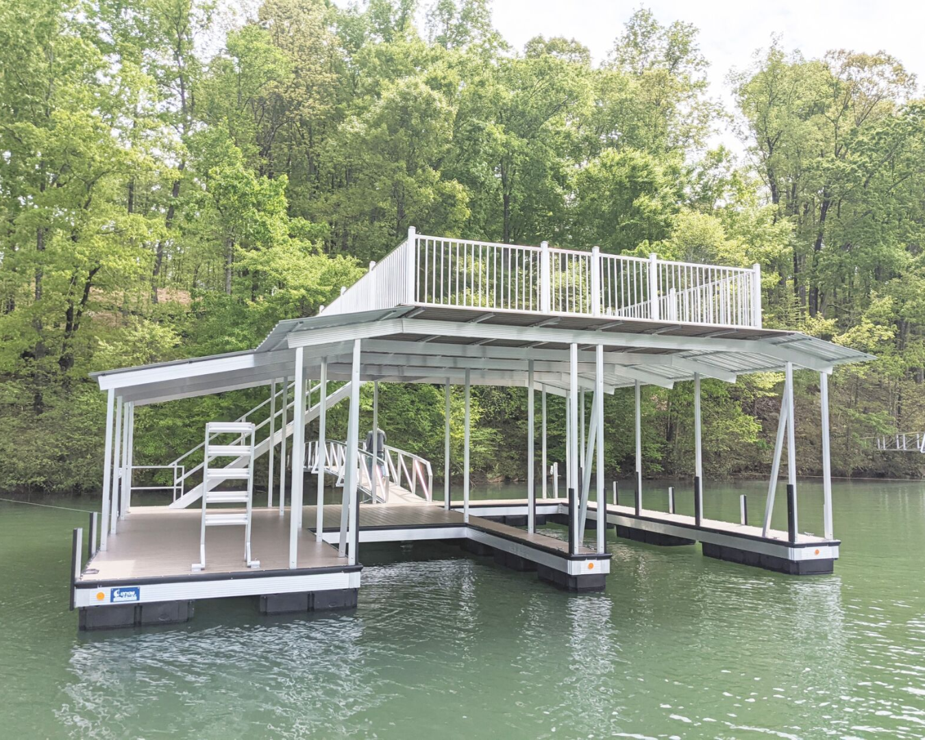 DPI dock floats supporting large floating marina dock system with multi-slip platforms by K+R Manufacturing