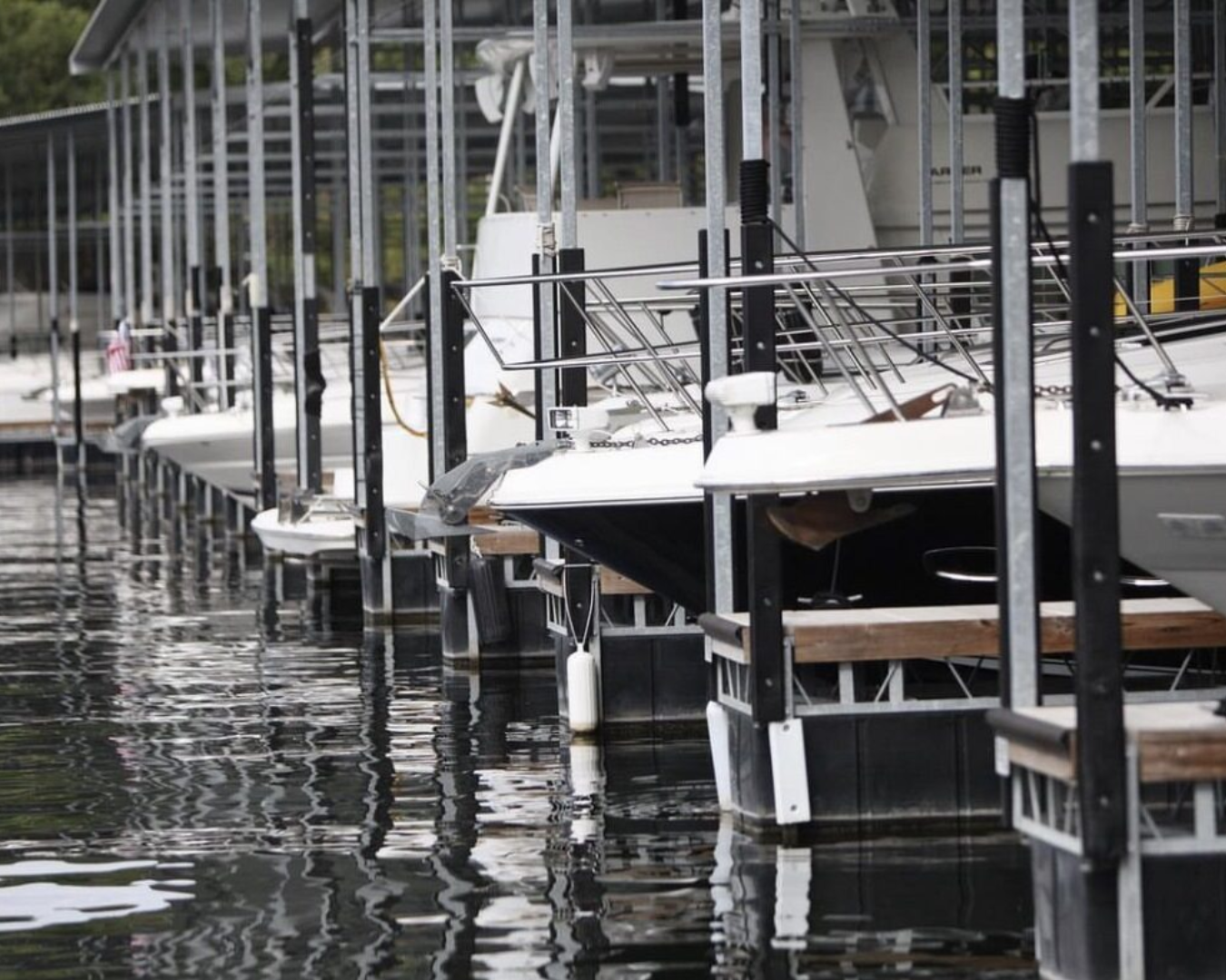 SuperCushion dock post bumpers protecting boats at commercial marina slips by K+R Manufacturing