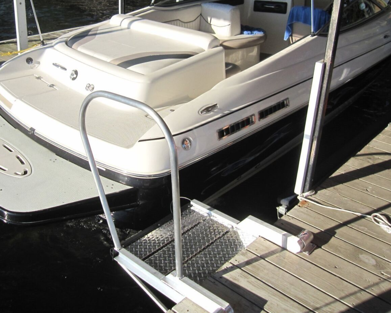 WetSteps EZ Board dock platform step installed between dock and boat for safe boarding access by K+R Manufacturing