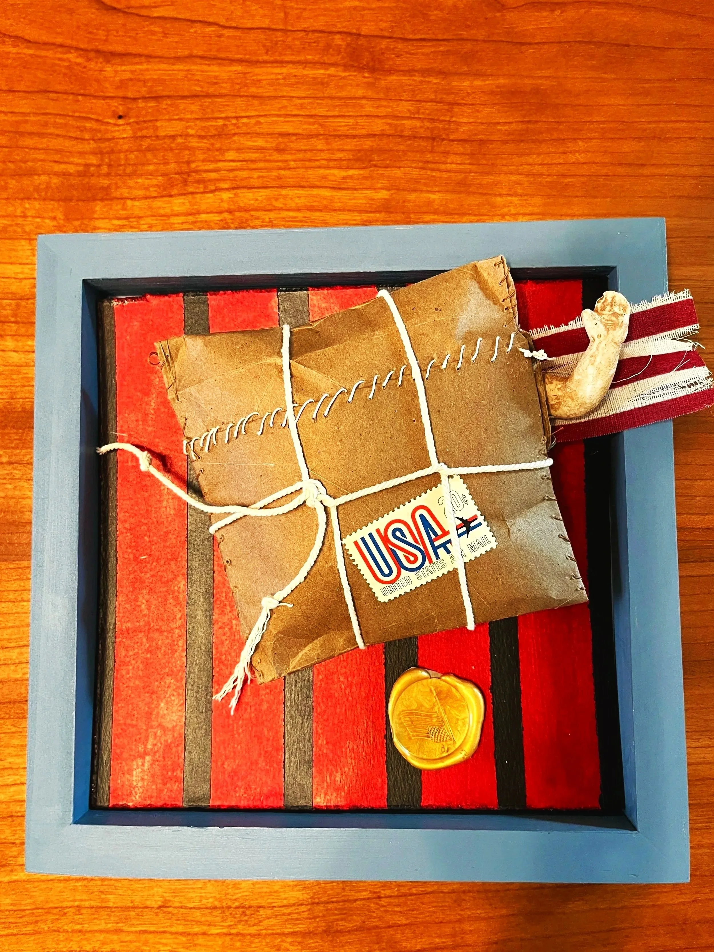 "Leaving Home #1", Mixed Media, paper, wax, acrylic, fabric, porcelain in cradled board, 8"x8", 2026
