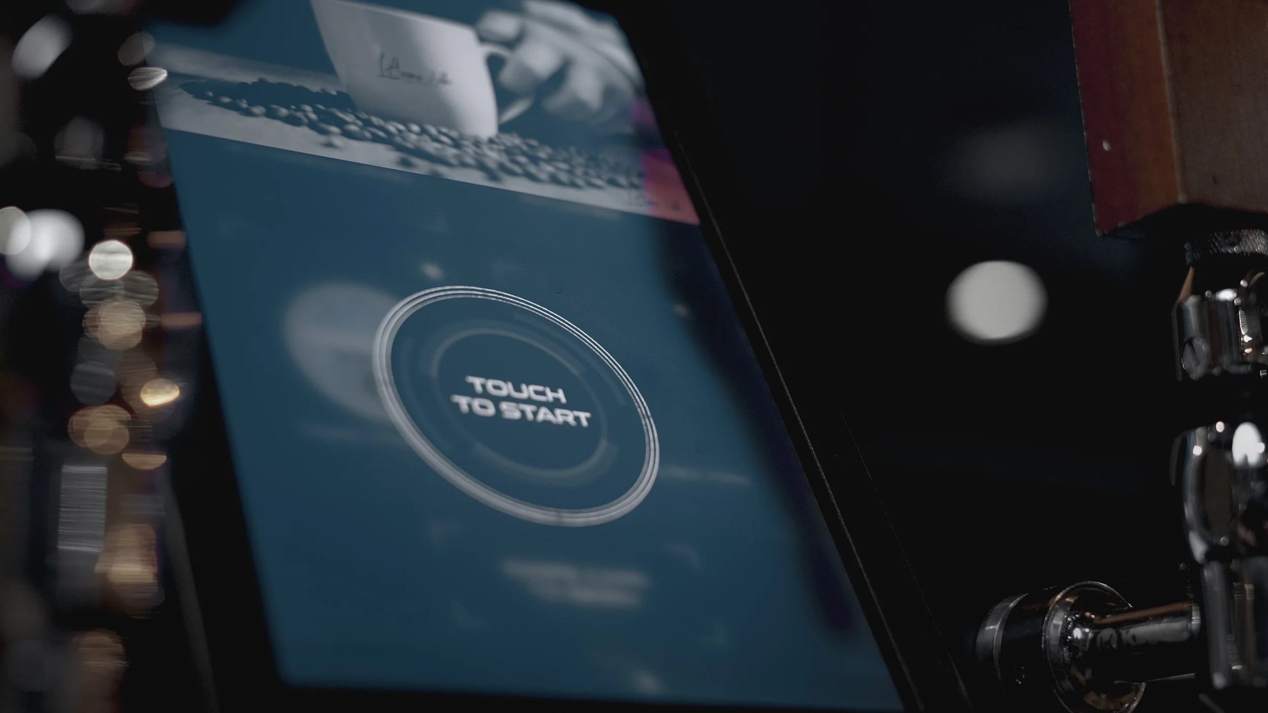 A device screen displaying a circular touch button with the text 'TOUCH TO START' in the center.