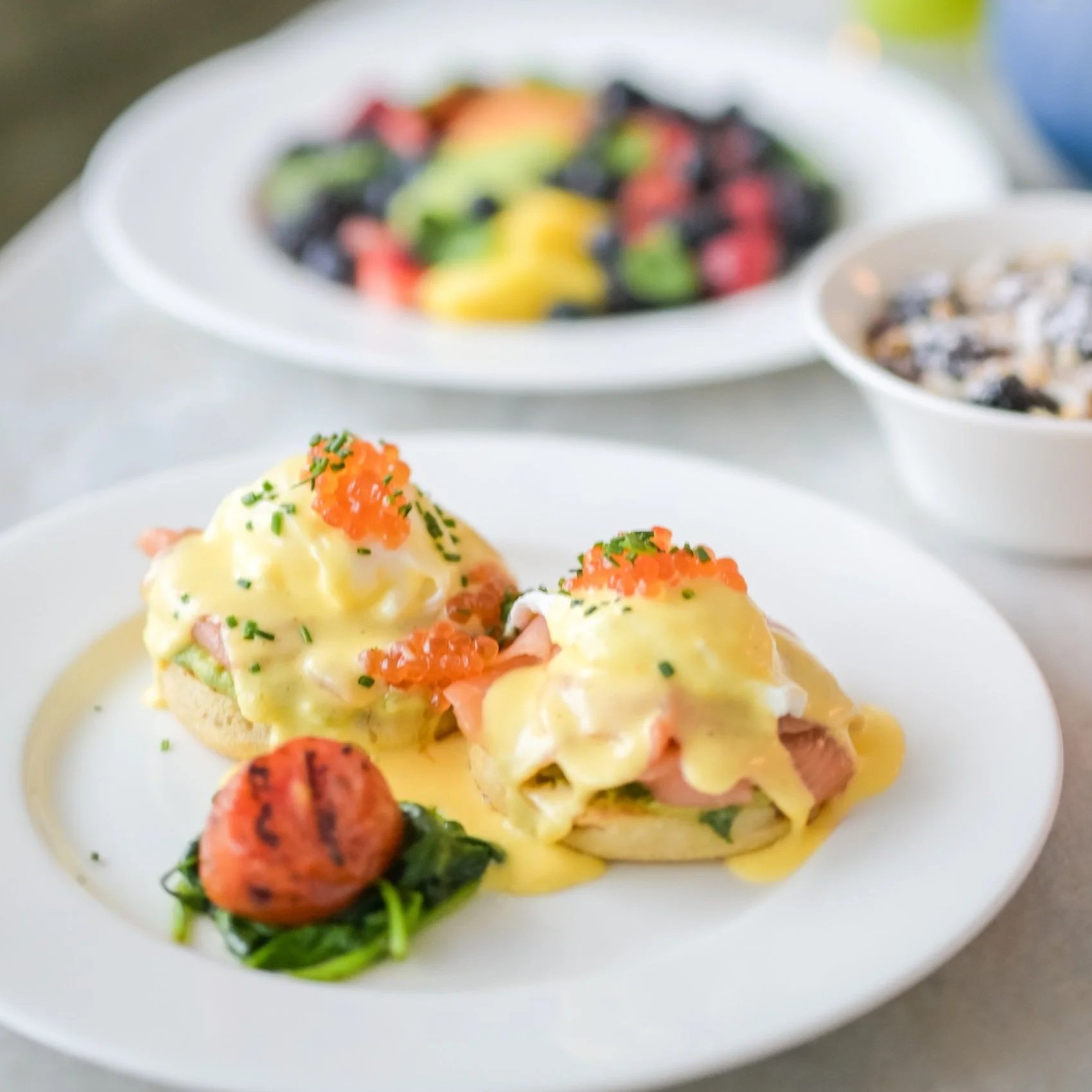 All Water Seafood & Oyster Bar Eggs Benedict Royale with salmon lox, poached eggs, smashed avocado, hollandaise, salmon roe and chives