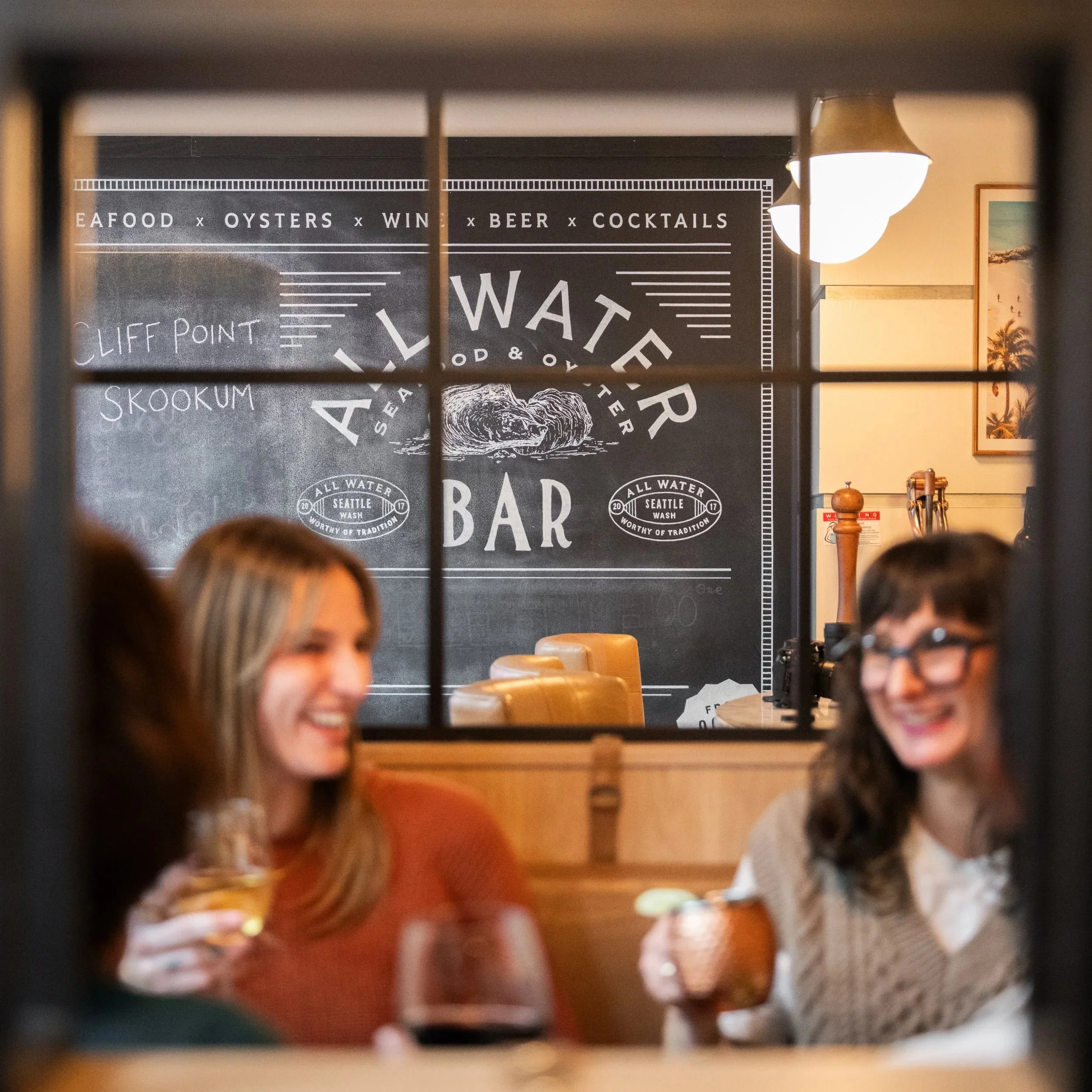 All-Water-Seafood-Dining-Lifestyle-Laughing-Background-Sign.jpg