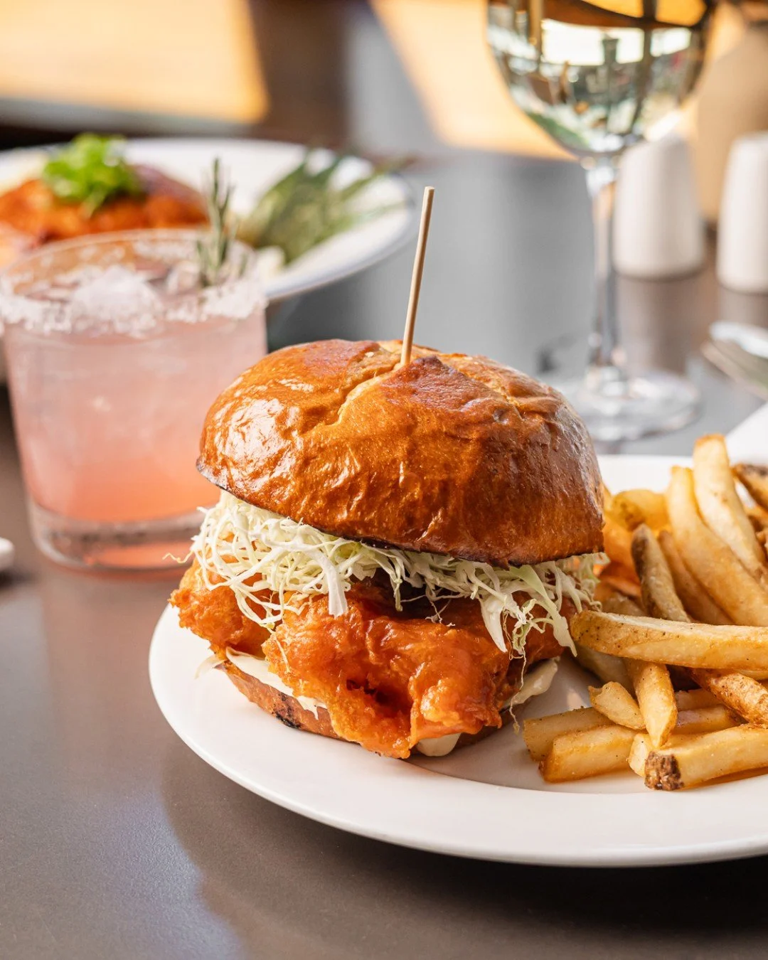 Fall comfort, served on a bun.🍂 
Crispy fish, a toasted roll, and a seat by the window to take in the city from the warmth of All Water. See you soon!
