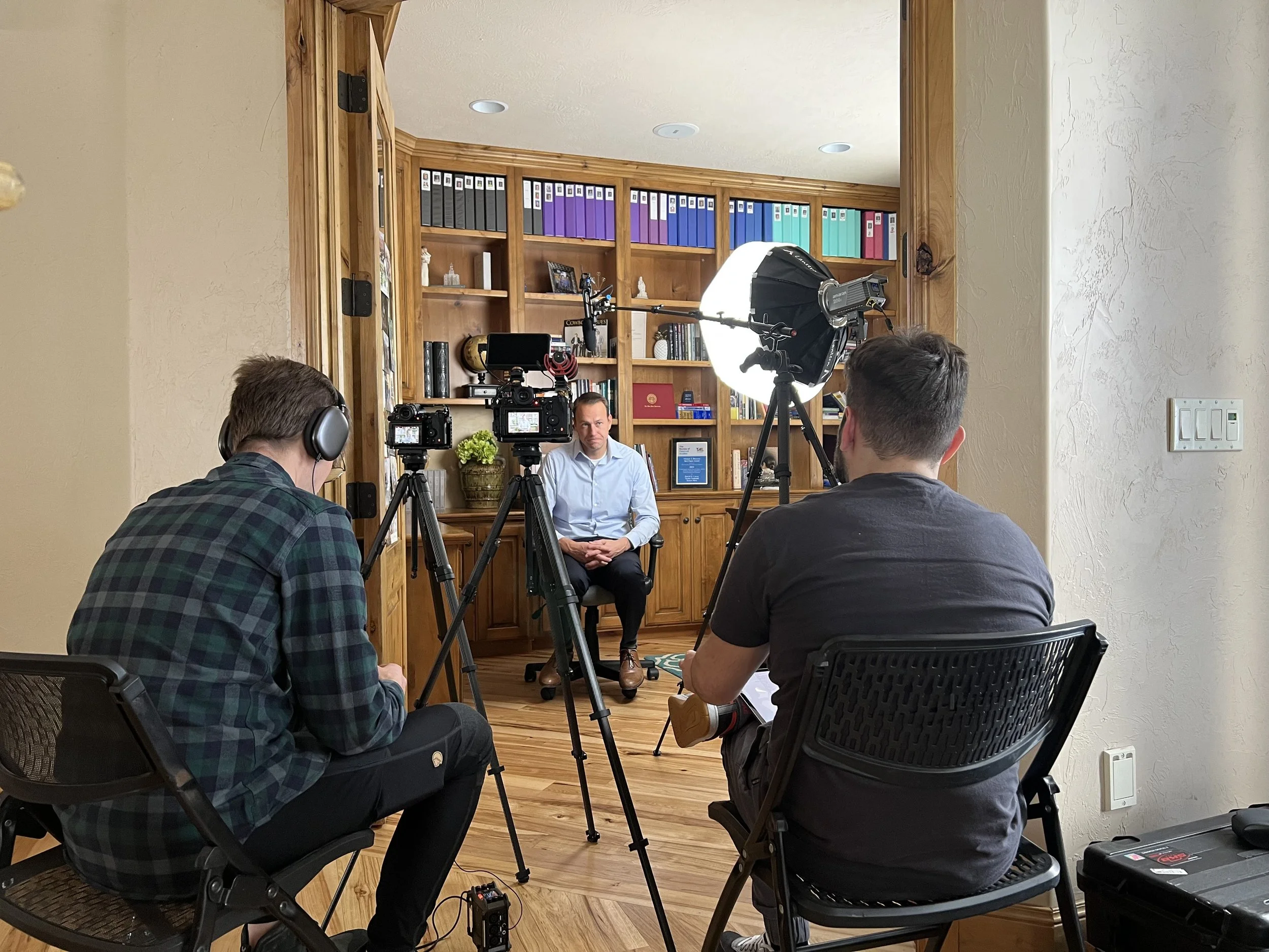 Behind the scenes: two-camera interview setup in a home office for The Real Cost, a student debt documentary directed by Sam Menendez and produced by Annie Menendez