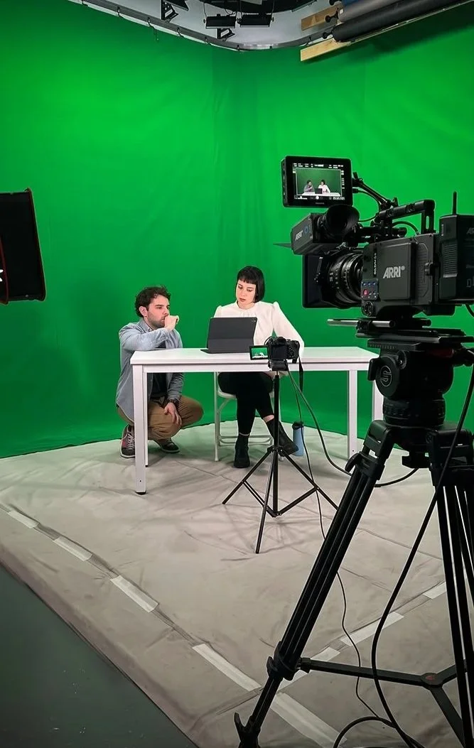 Sam Menendez directing on a green screen set for Apollo Studios