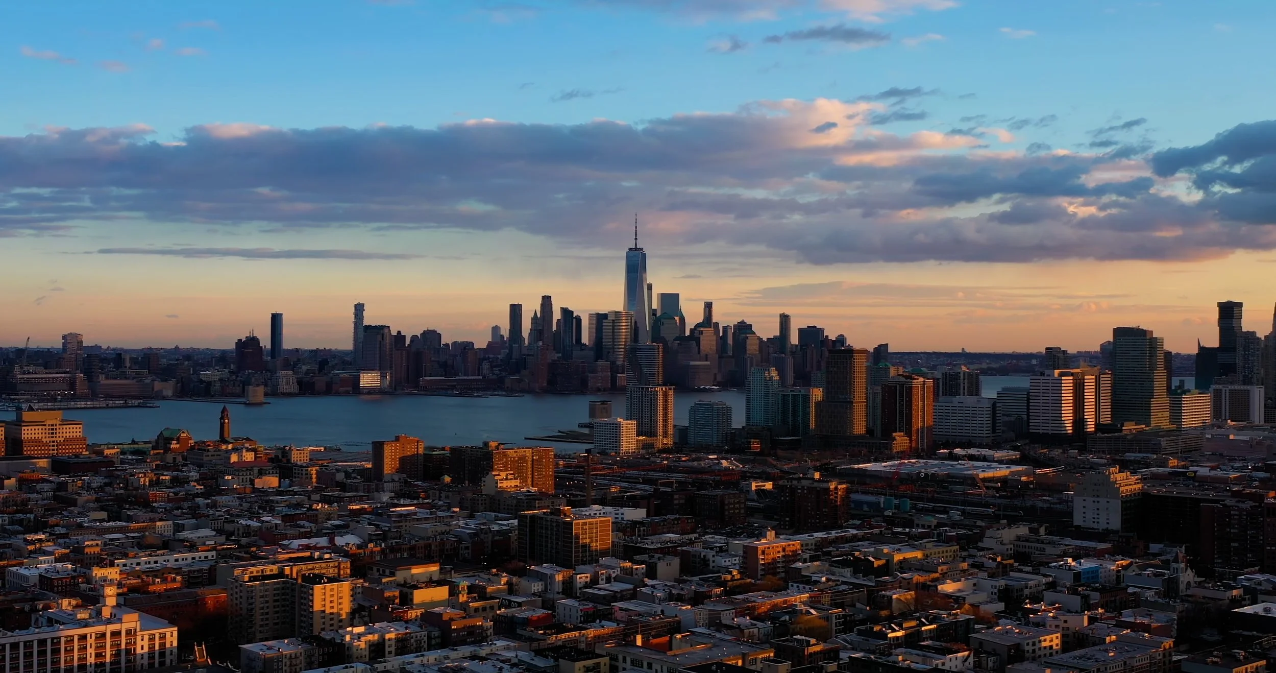 New York City skyline at sunset. Still from The Real Cost, a student debt documentary directed by Sam Menendez and produced by Annie Menendez