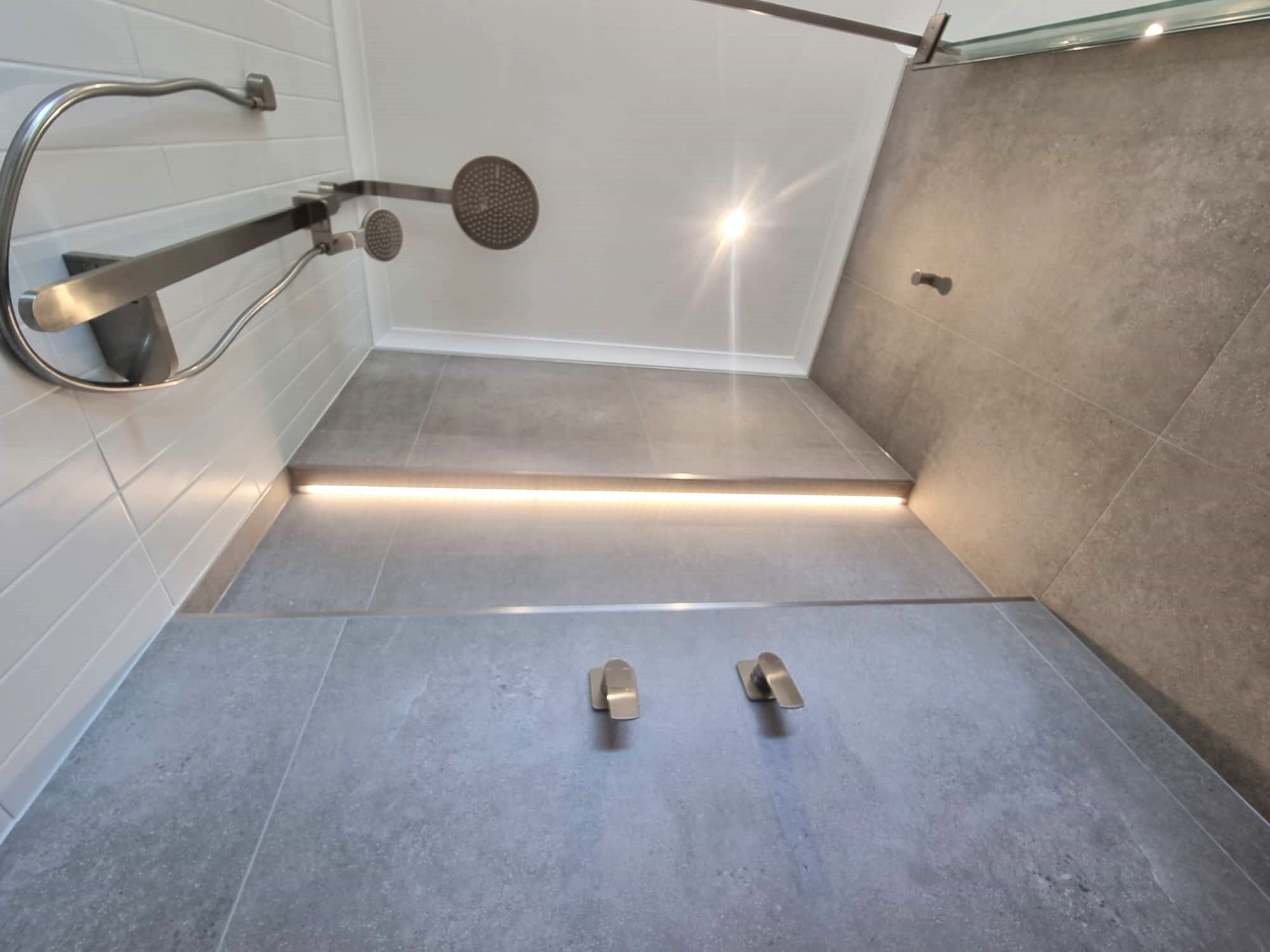 Shower goals in our recently completed Bathroom Renovation project in Newport. 

Our customers chose beautiful brushed nickel fittings and fixtures from @phoenixtapware and we fitted a full length niche with LED strip lighting to really give this sho