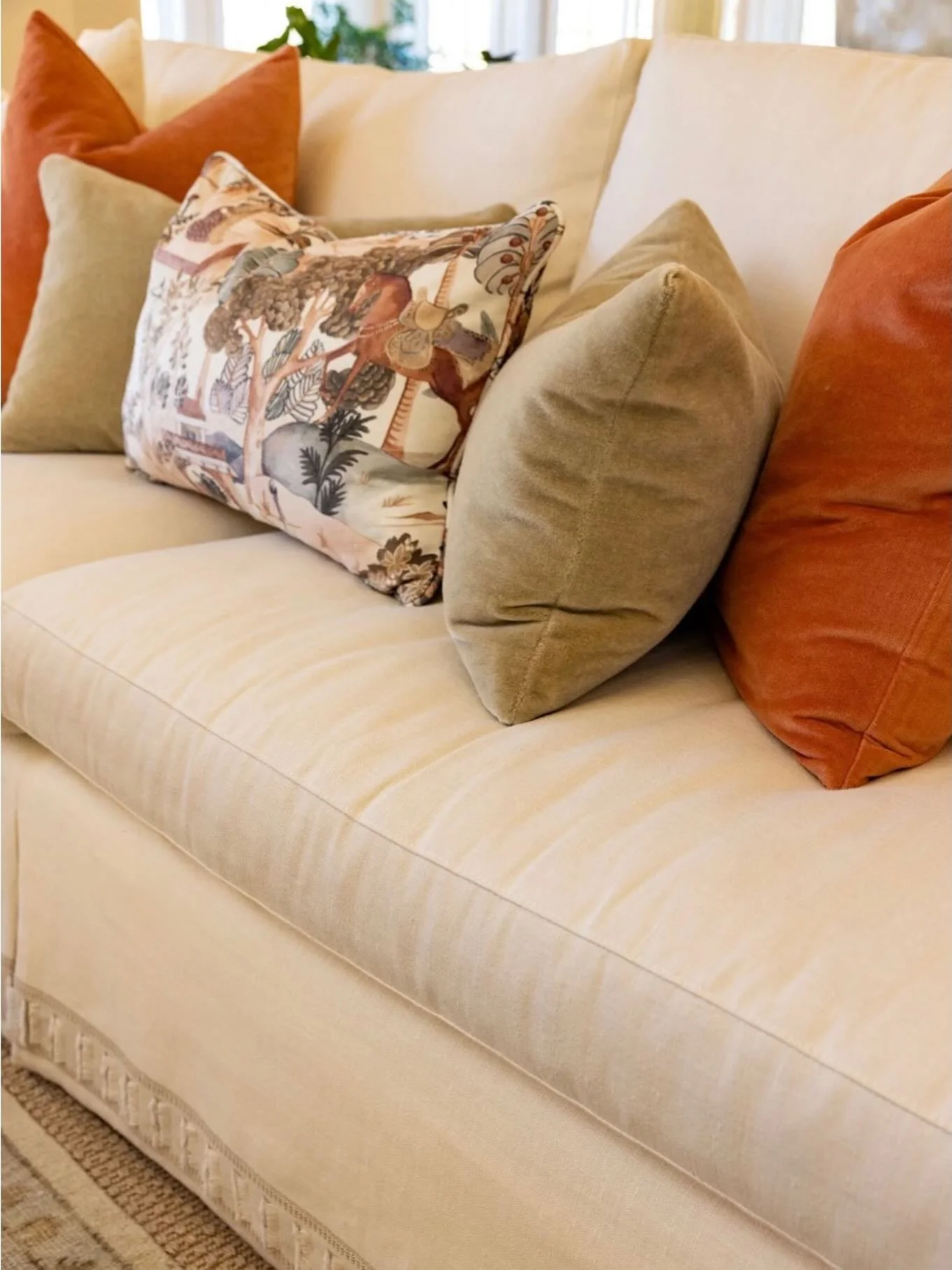Having a hard time choosing your sofa fabric? Neutral fabric allows for freedom of patterns in your throw pillows.