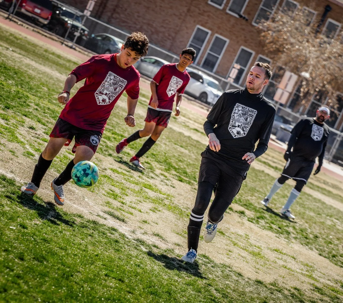 Chris playing soccer during the Segundo Barrio Futbol Club's annual Charity Cup match.