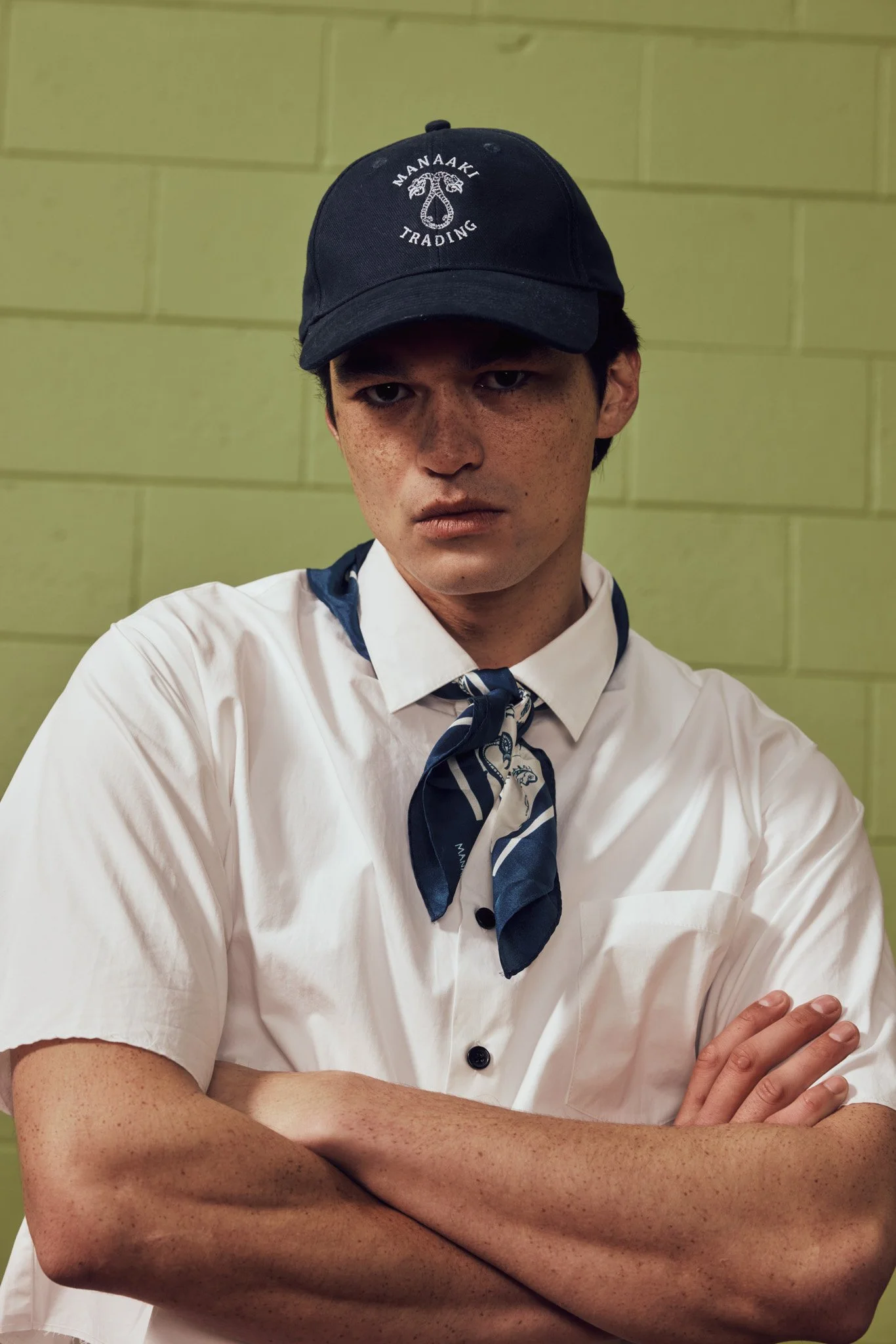 White-shirt-cropped-collar-denim-short-light-wash-raw-cut-cropped-vintage-nautical-cap-logo-logo-mens-the-landing-lookbook-ss26-2.jpg