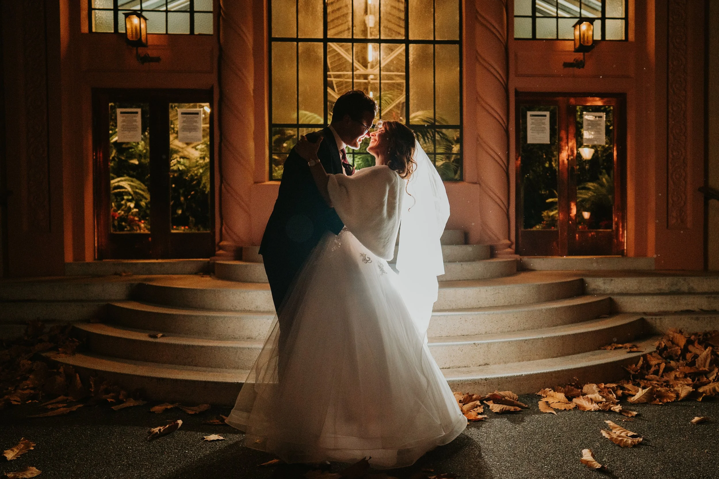 Couple share a night time kiss after their ceremony 