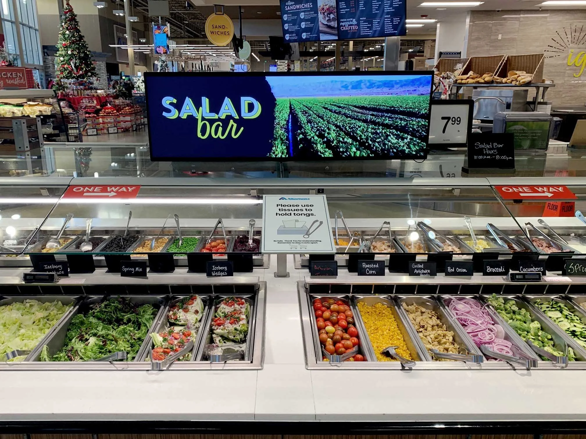 Bluefin commercial digital signage display showing a salad bar menu in a retail environment for enterprise applications