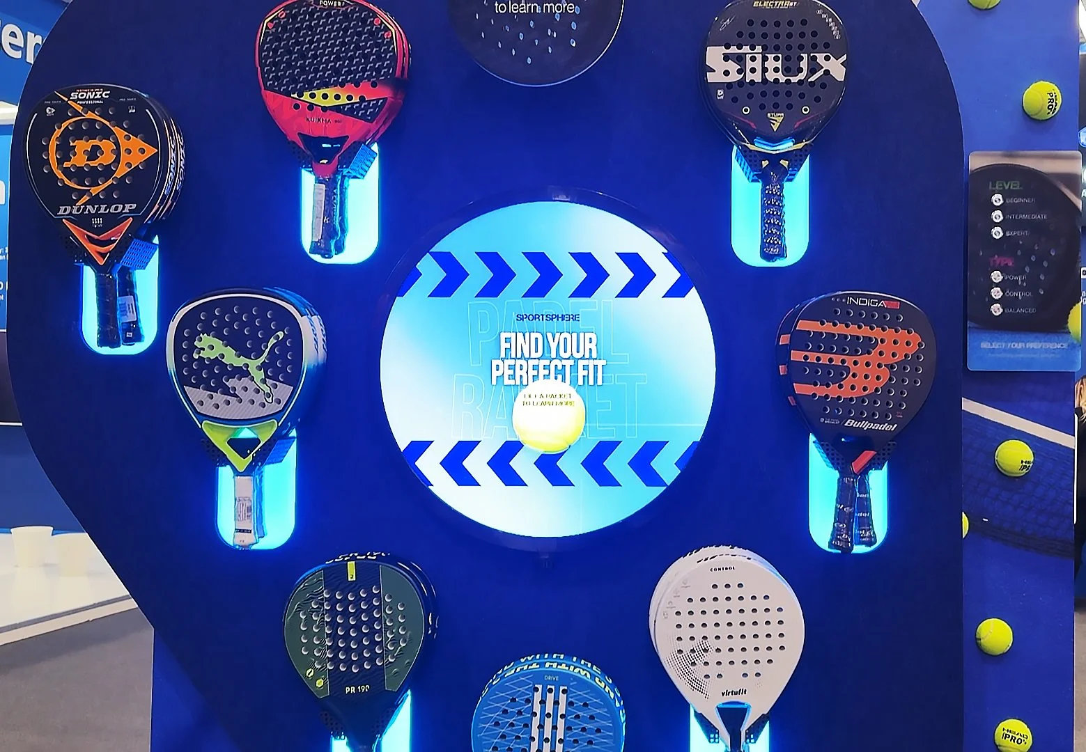 Retail digital signage circle screen demonstrating Lift and Learn feature for padel equipment