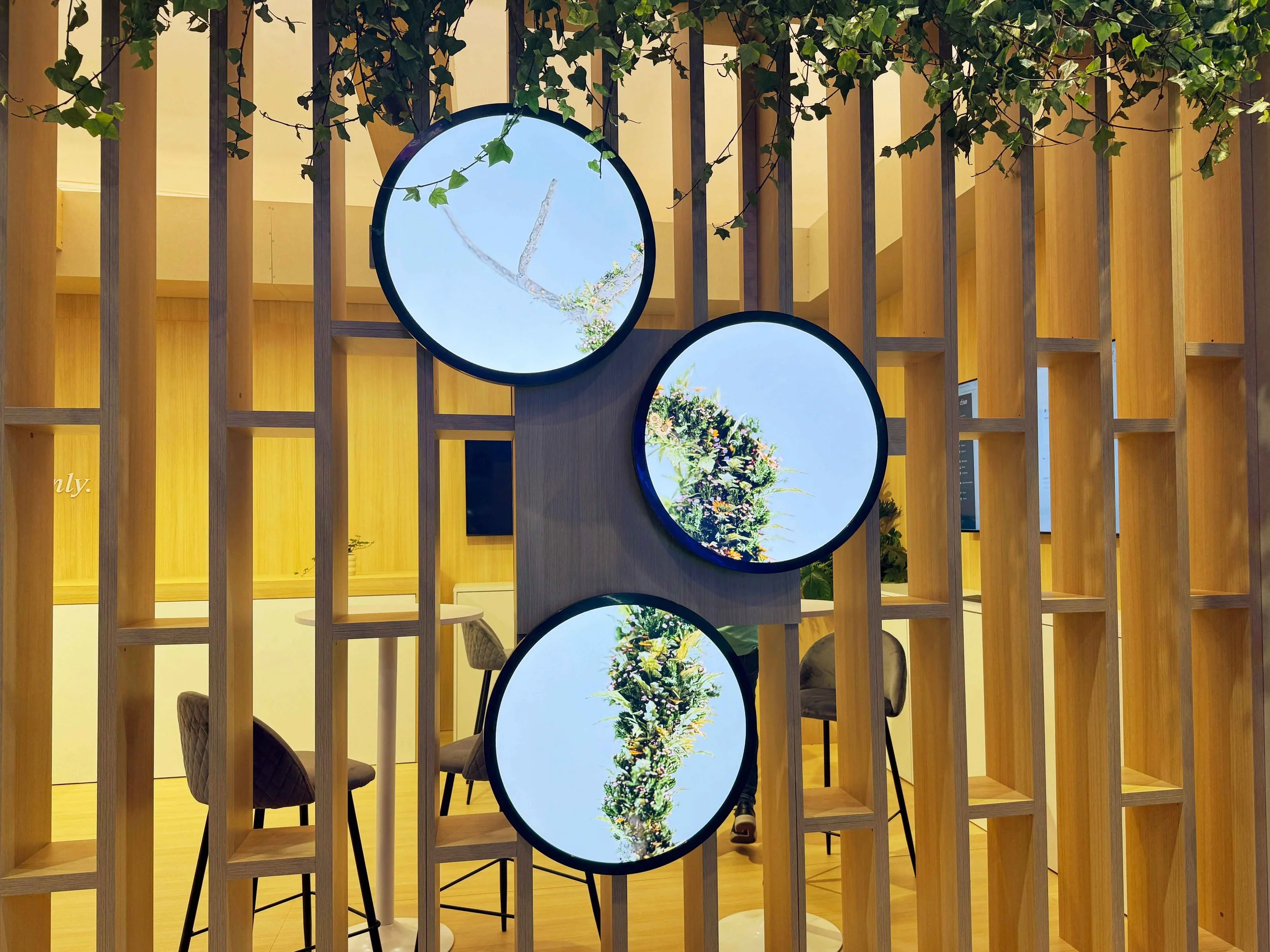 Creative circular digital signage solutions for modern corporate lobby and reception areas.