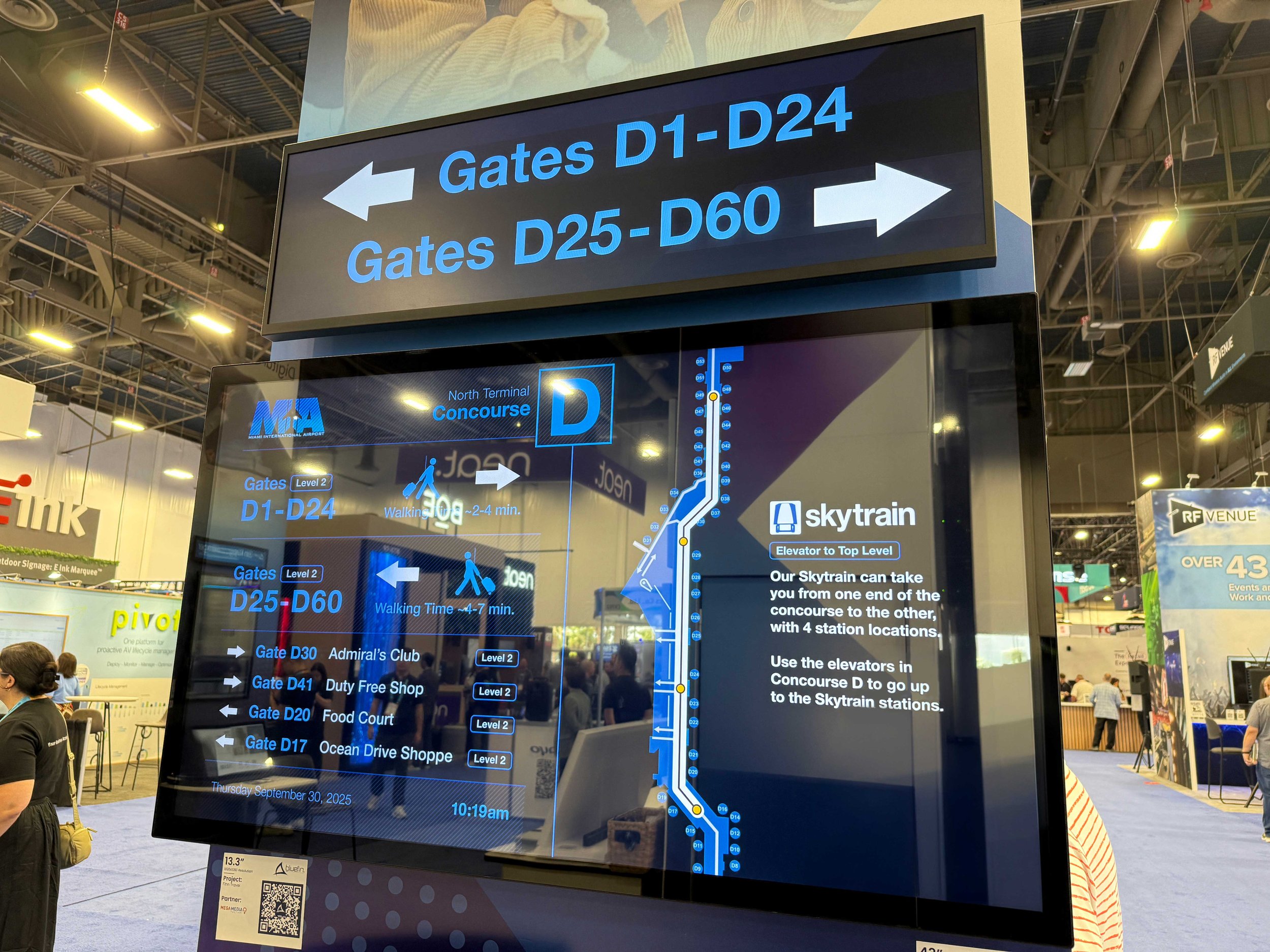 Commercial digital signage providing real-time transit updates and wayfinding for passengers.