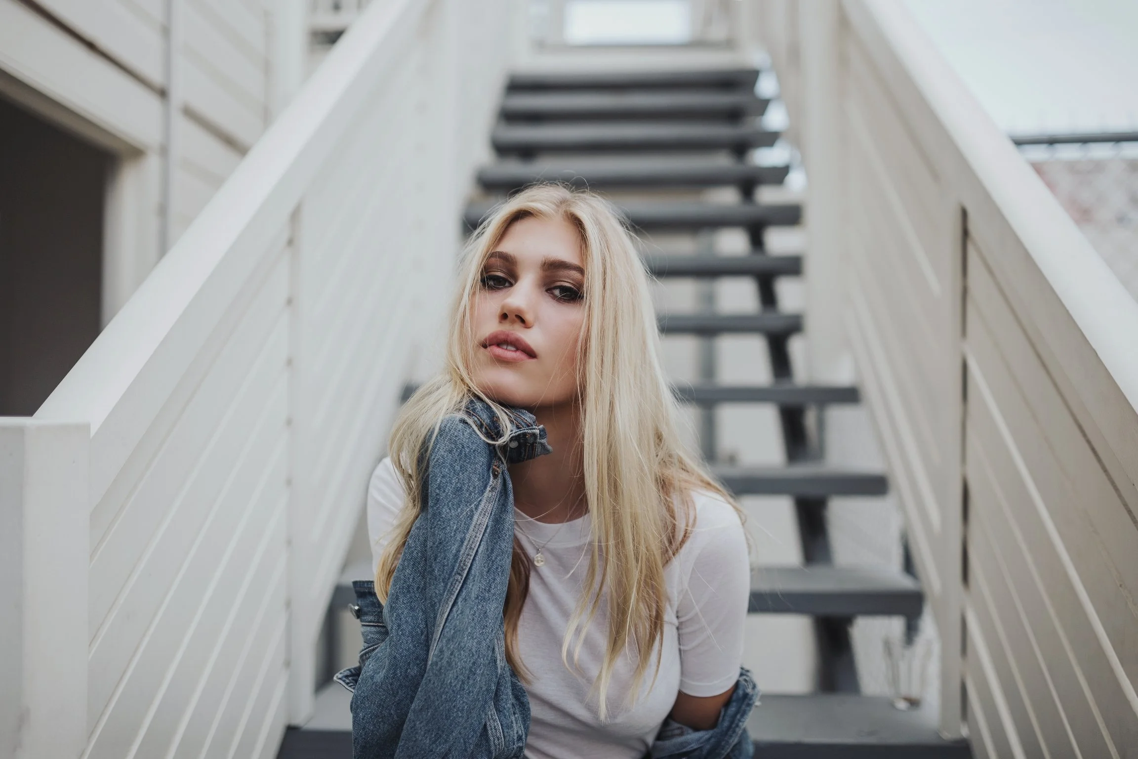 Model poses on steps for fashion test.