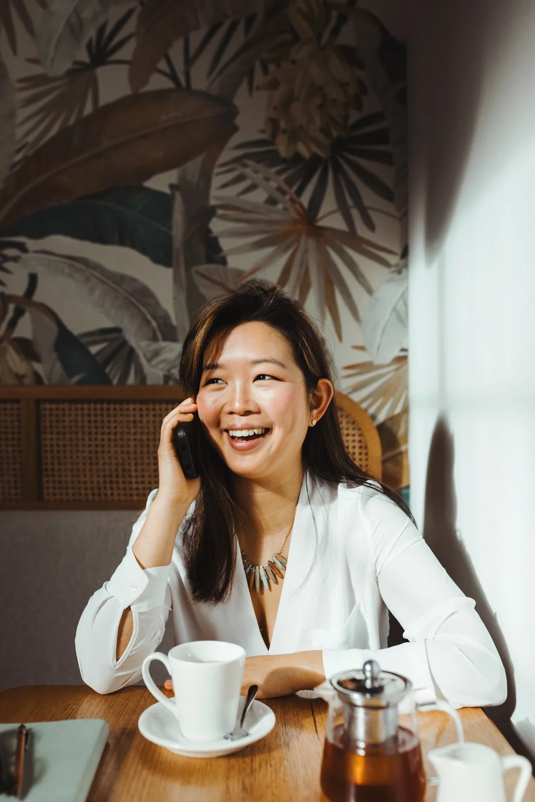 Digital marketer laughs during lifestyle branding photography in Tasmania.