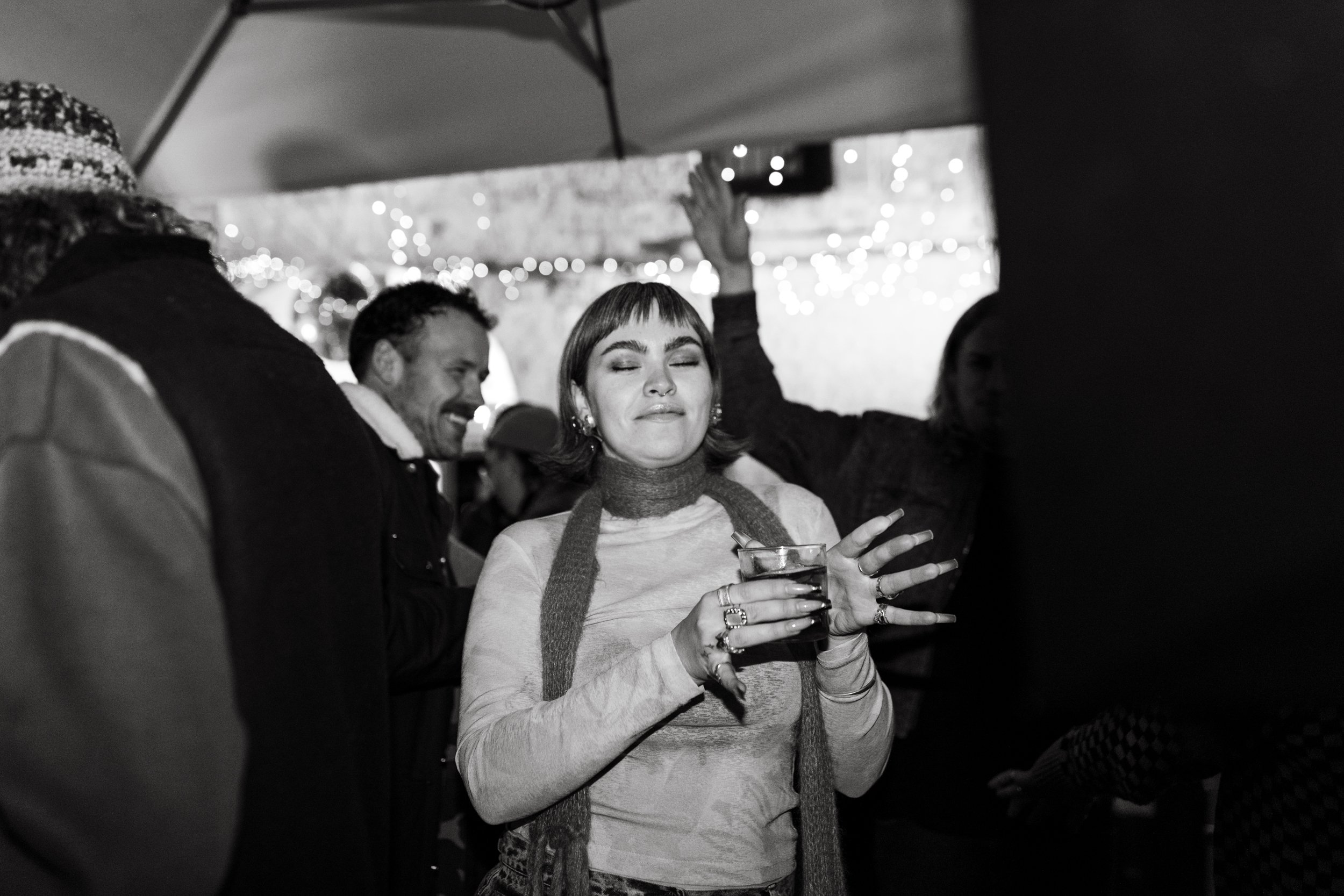 Woman dances at event in Hobart bar.
