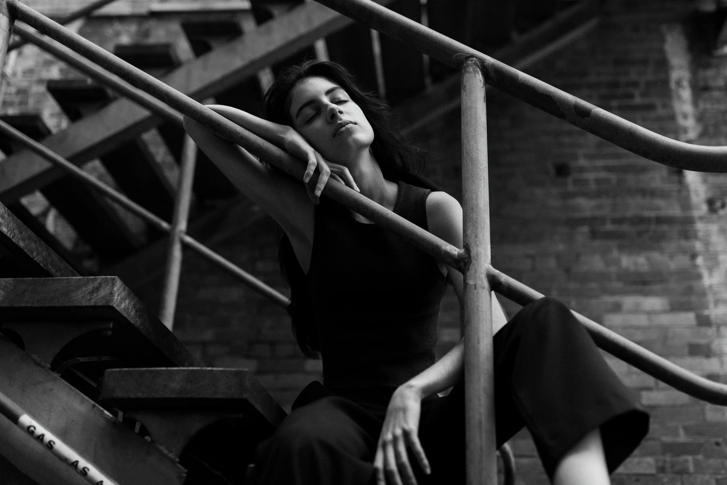 Musician poses in industrial look branding photo shoot.