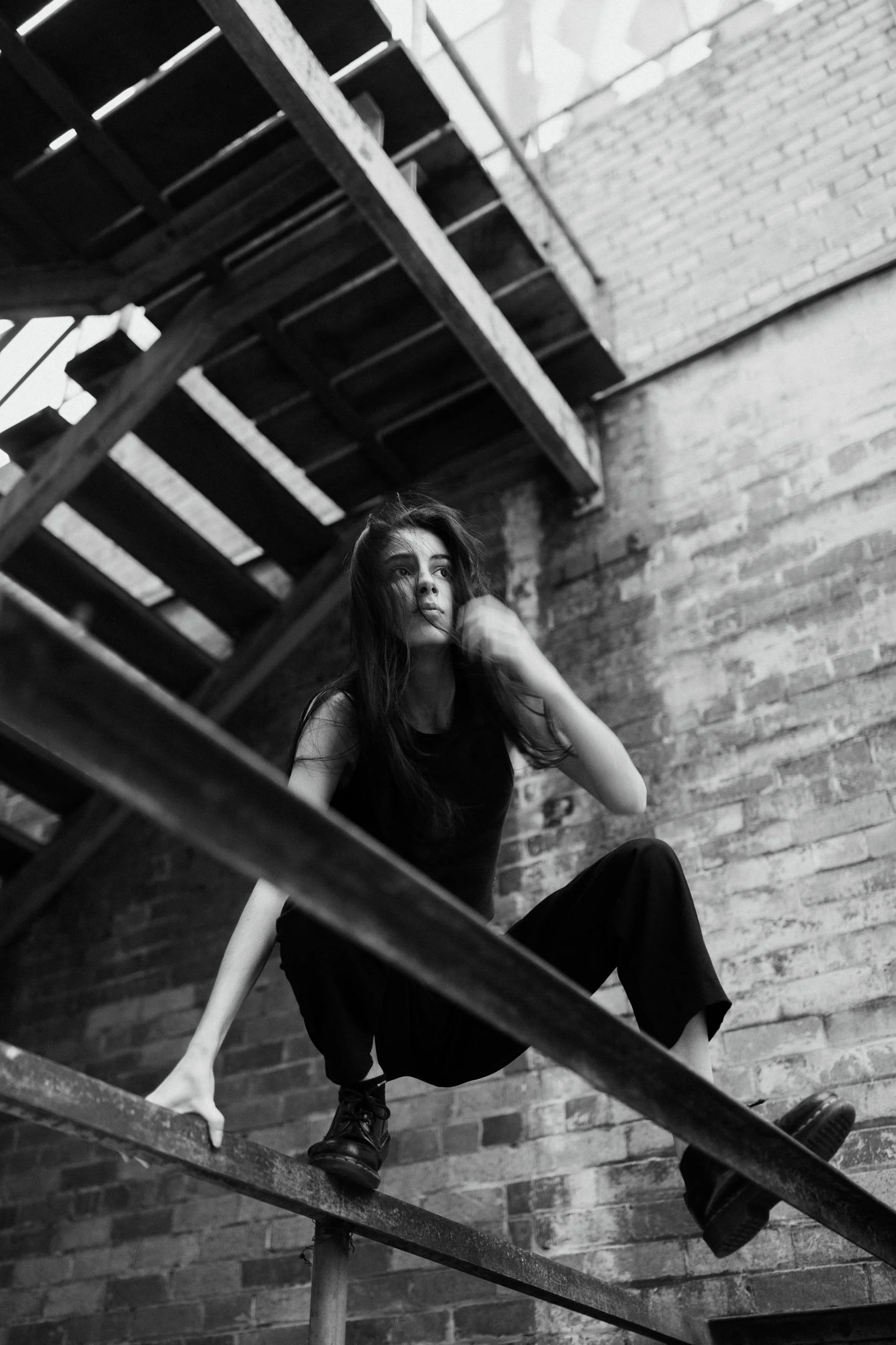 Felony crouches on steel foundations in Brisbane profile bio photo shoot.