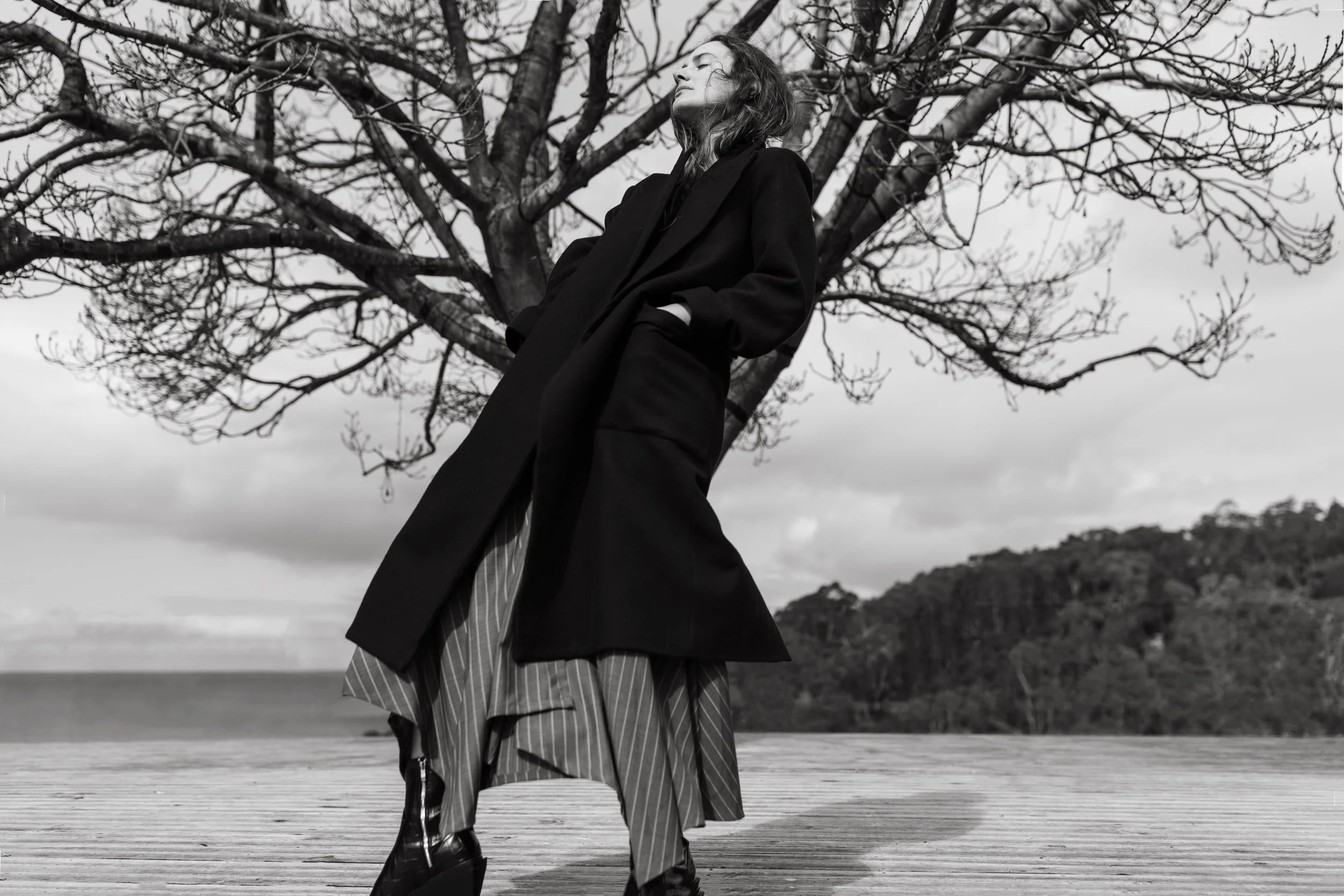 Model poses in Arnsdorf coat for styled commercial photo shoot.