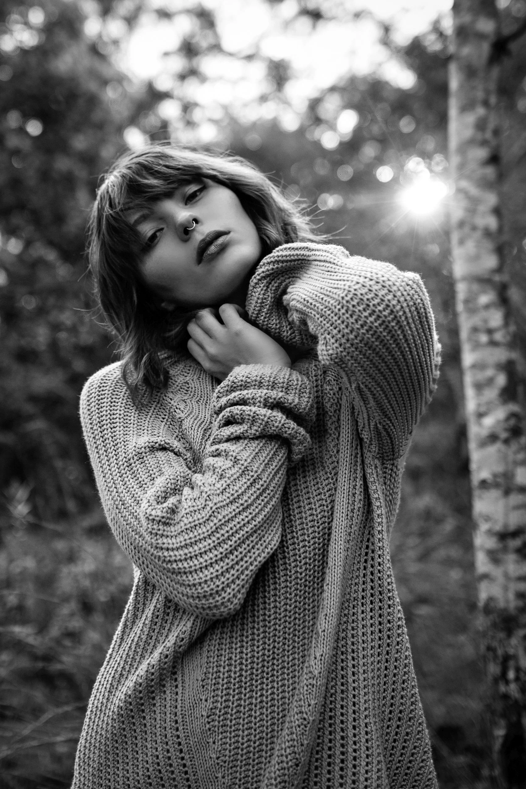 Model poses with sun behind her in test shoot in Brisbane, Qld.