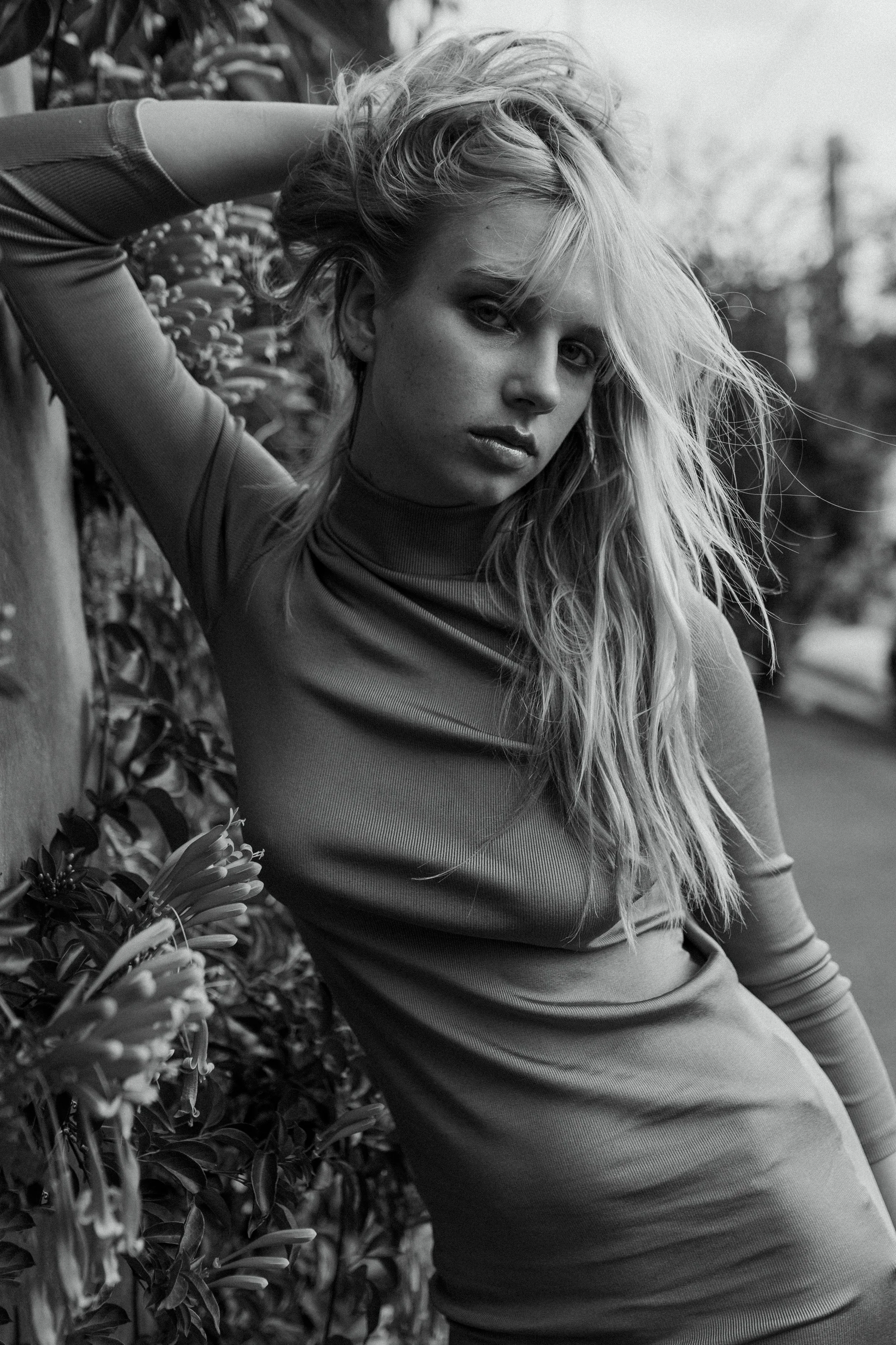 Model poses against fence for test shoot in Brisbane.