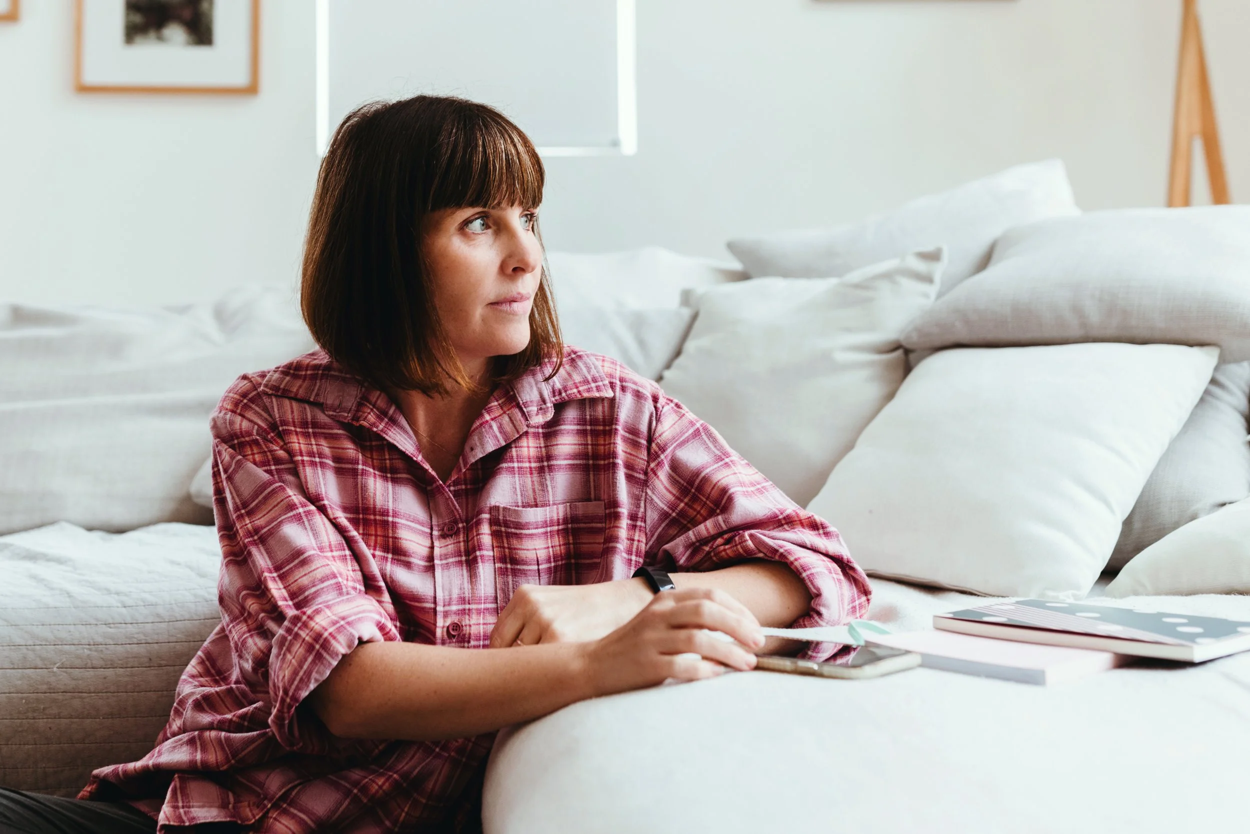 Copywriter sits for lifestyle branding portrait.