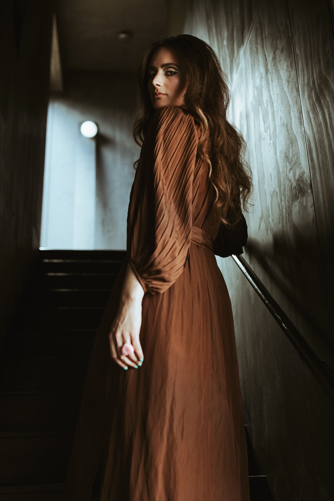 Model poses in silk dress in Hobart Air Bnb.