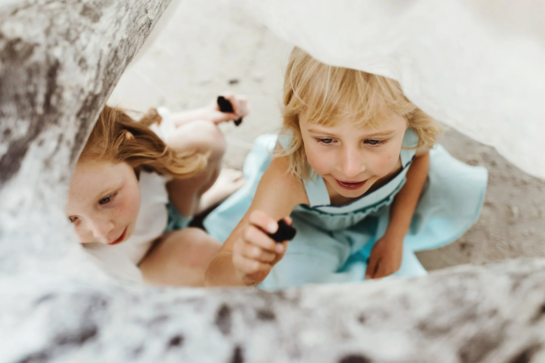 Girls play at beach in Hobart.
