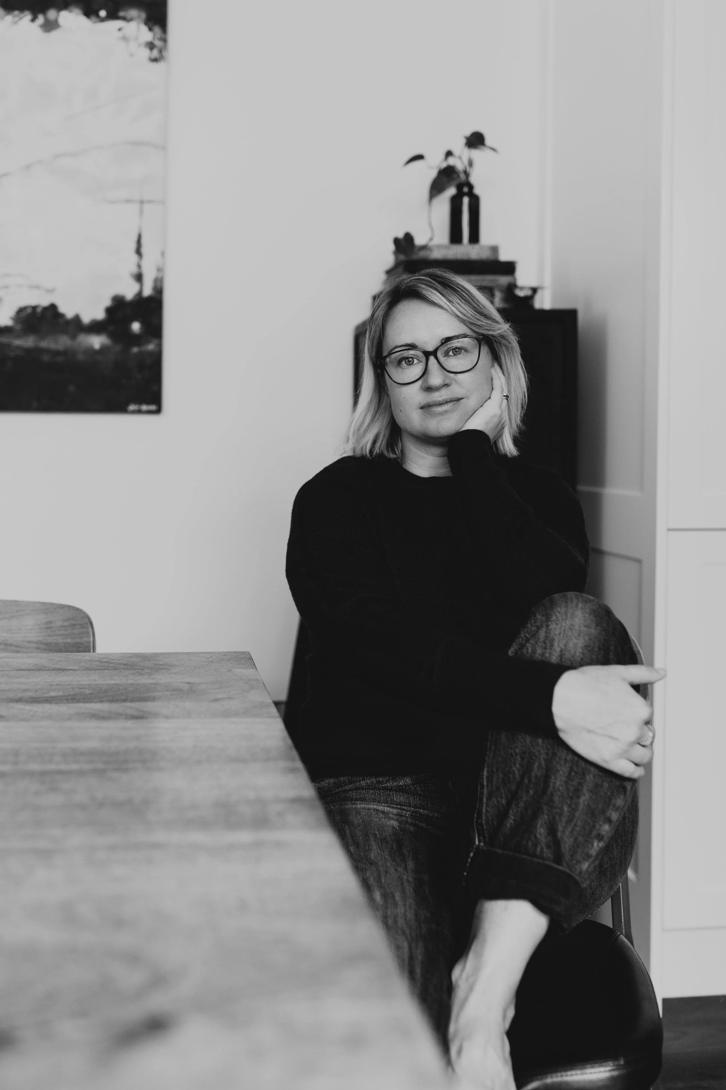 Writer in relaxed and natural pose for branding photography.