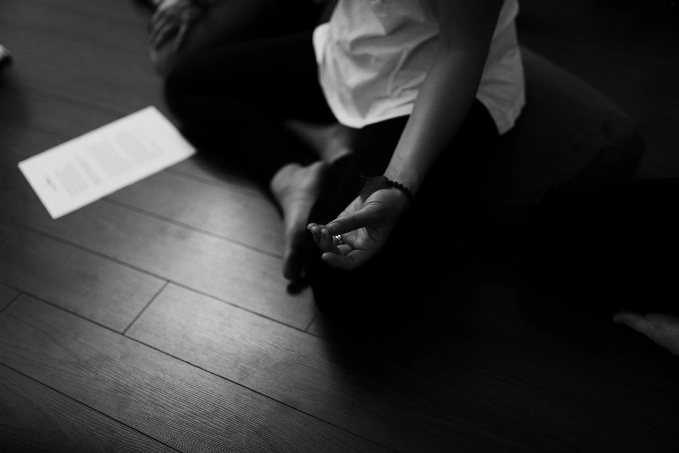 Close up of hands in prana mudra.